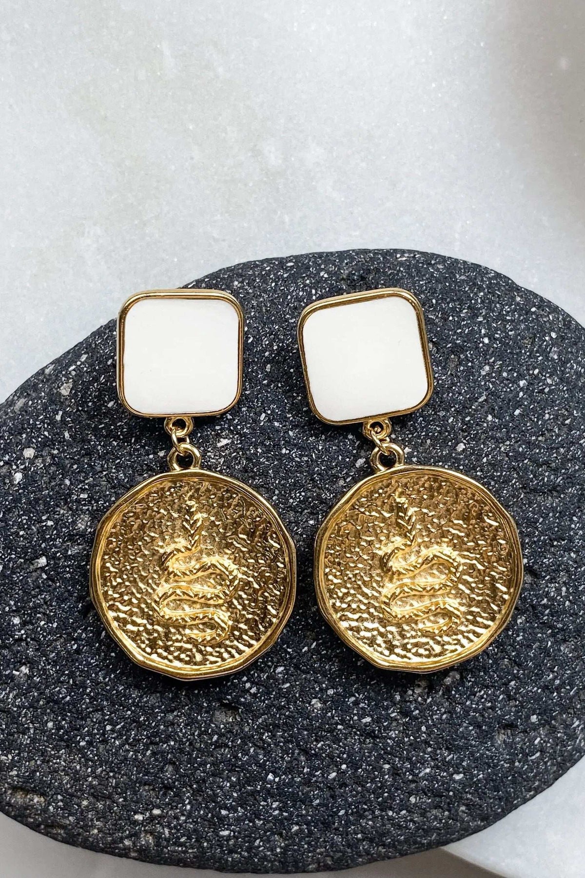 MEDUSA Gold Coin Earrings with gold-tone textured round medallions, white square studs, and dangling coin charms