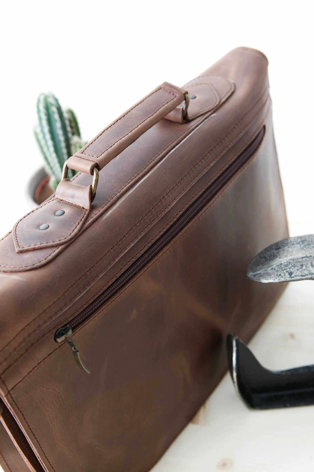 MEN'S BRIEFCASE with pocket in brown full-grain leather, featuring a top handle and zippered compartment