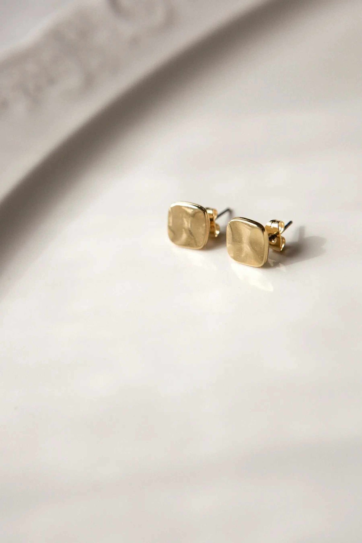 Mini Antique Square earrings in gold-tone metal with a textured antique finish and rounded square stud design