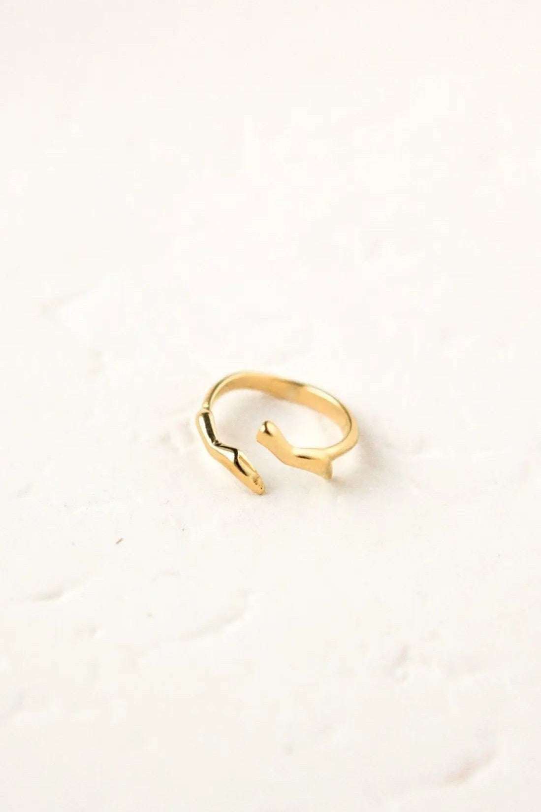 Minimalist gold filled ring with a polished gold-tone open band and distinctive angular ends