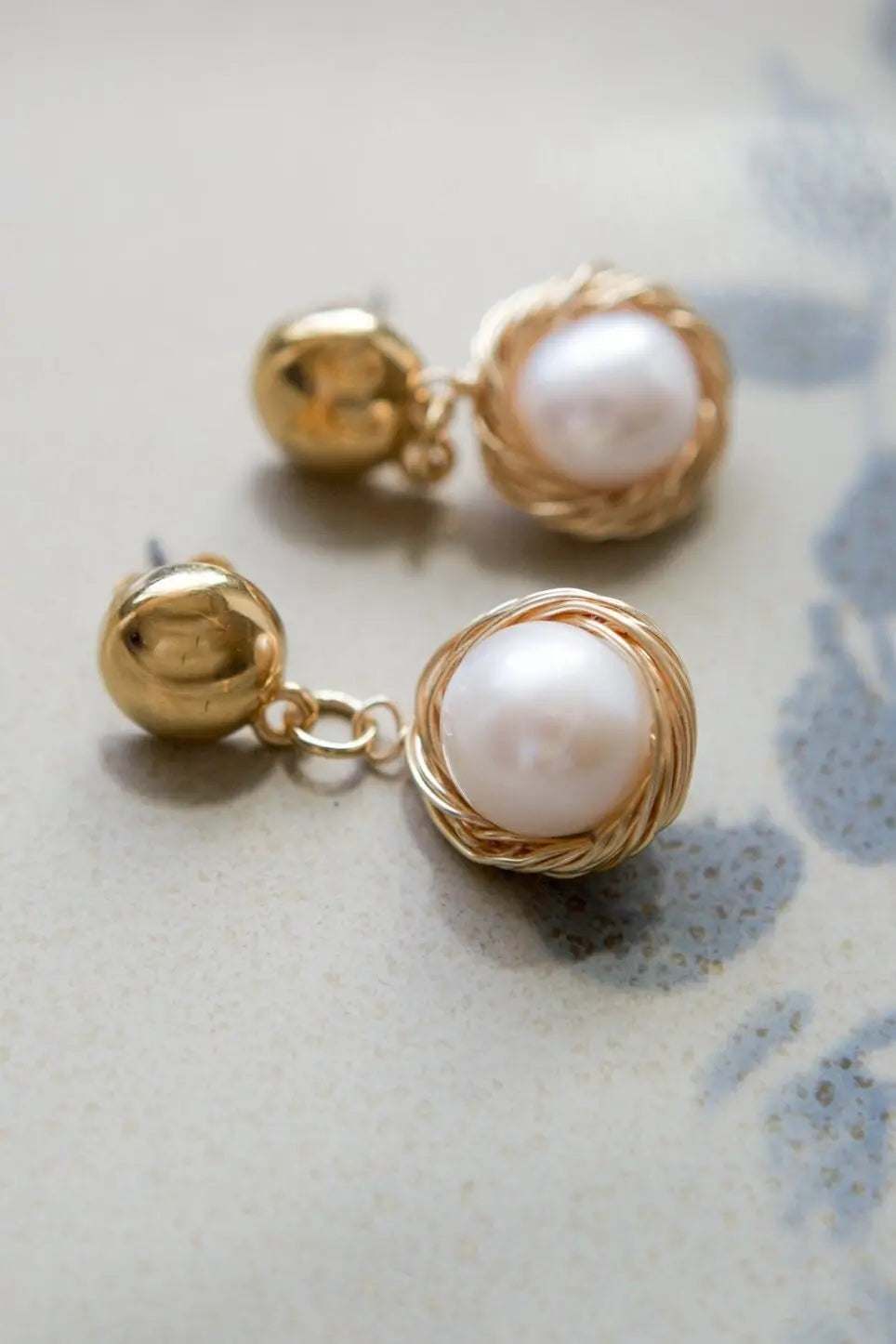Mother of pearl Earrings with white pearl beads, gold-toned wire wrapping and polished spherical studs