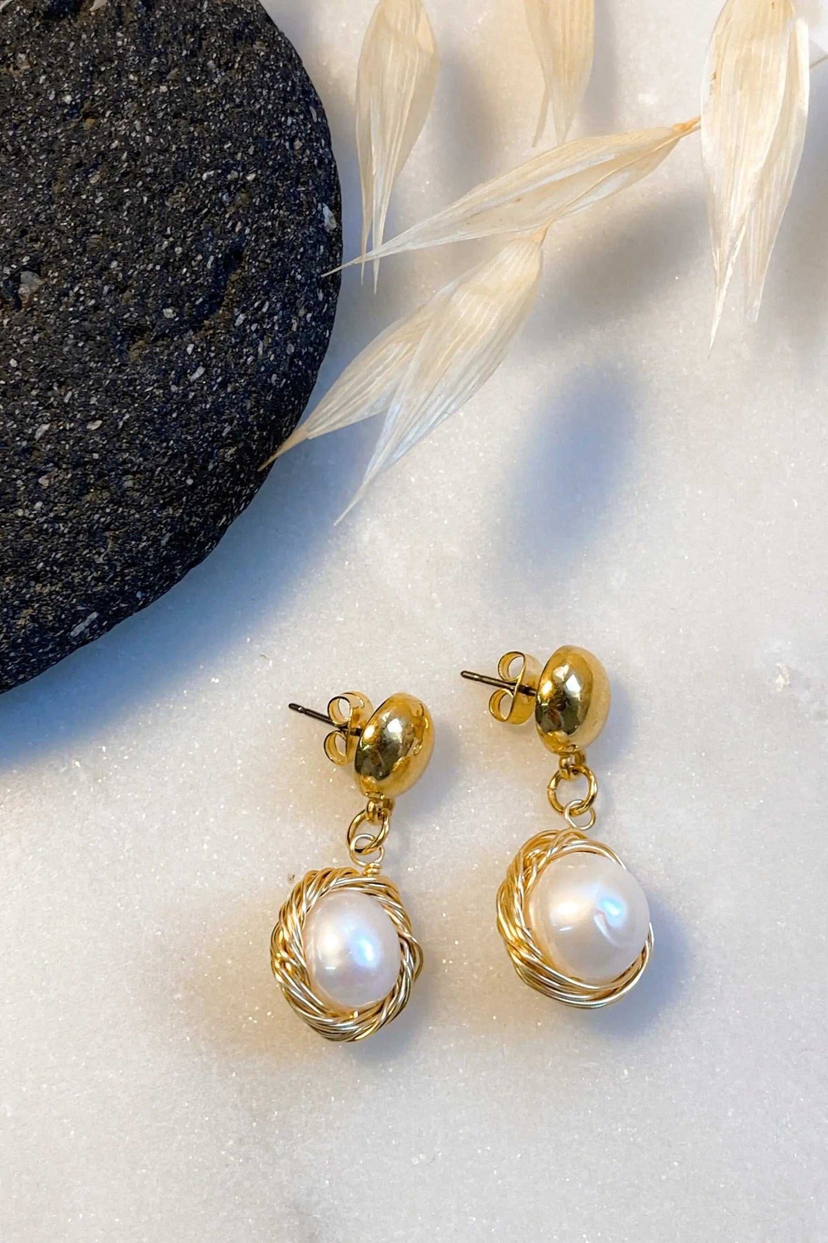 Mother of pearl Earrings with luminous white pearls in ornate gold-tone twisted wire settings and drop design
