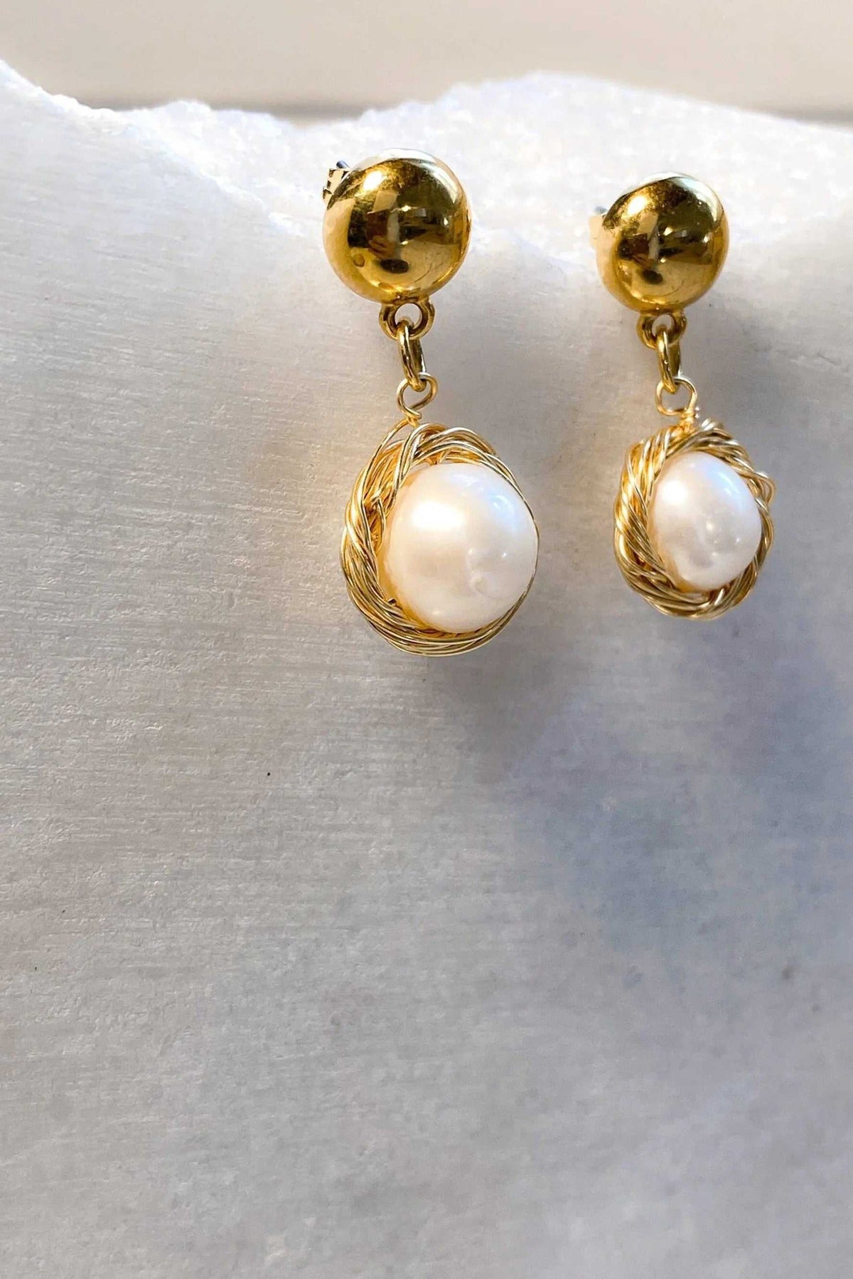 Mother of pearl Earrings with white round pearls wrapped in textured gold-tone wire and polished gold stud tops
