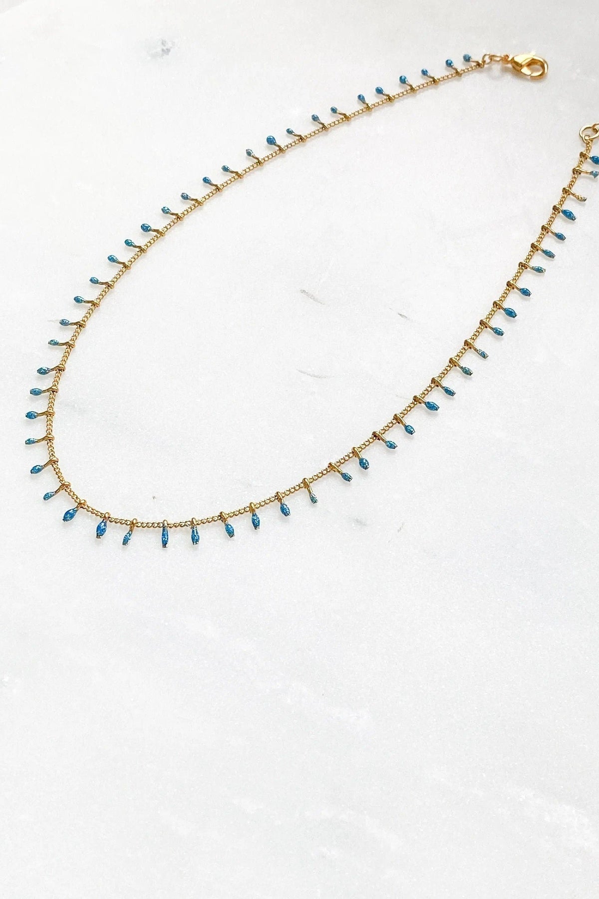 Mum Gift Dainty Necklace with gold-tone thin chain and evenly spaced blue teardrop beads