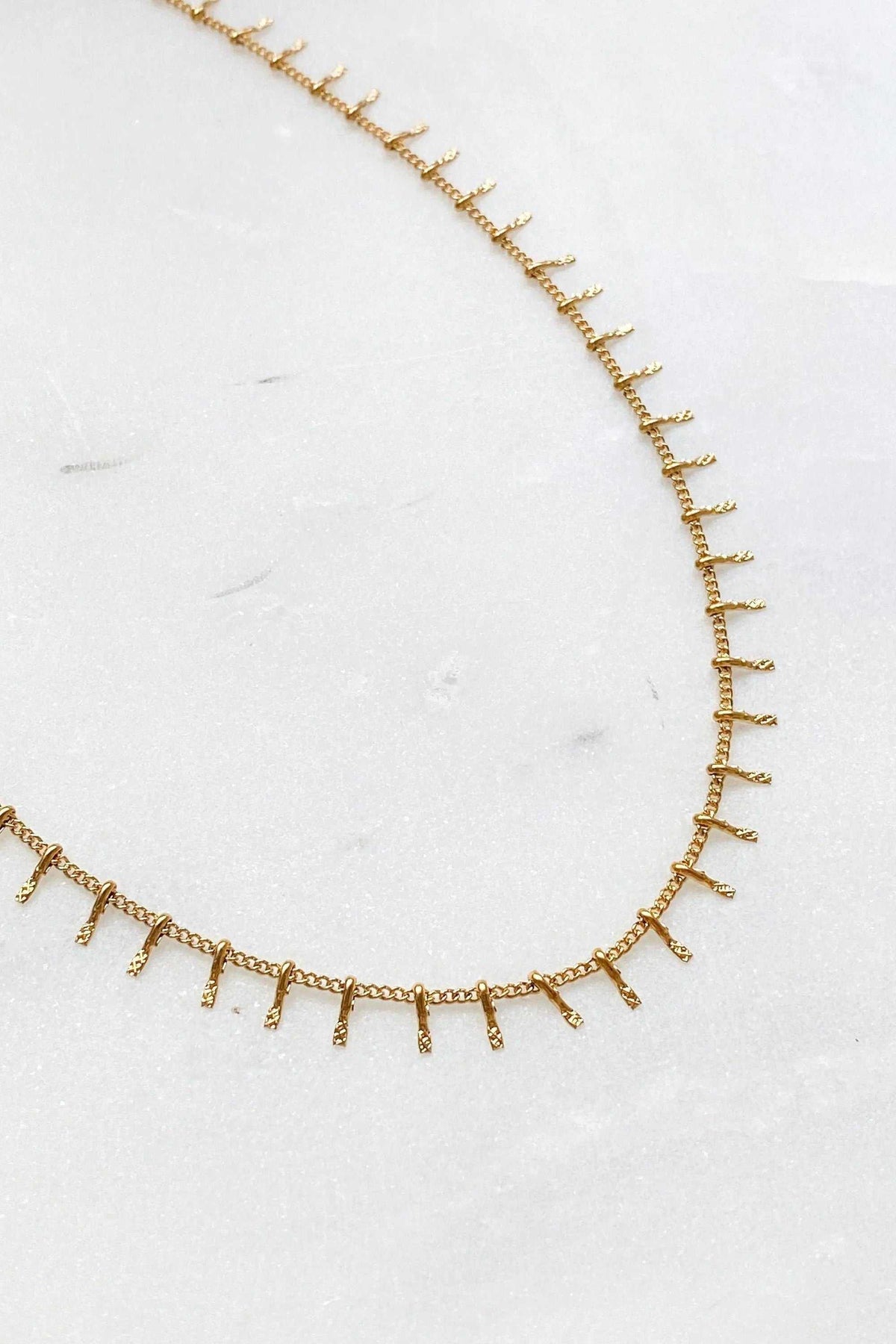 Mum Gift Dainty Necklace in gold-toned steel with a thin chain and evenly spaced dangling bar details