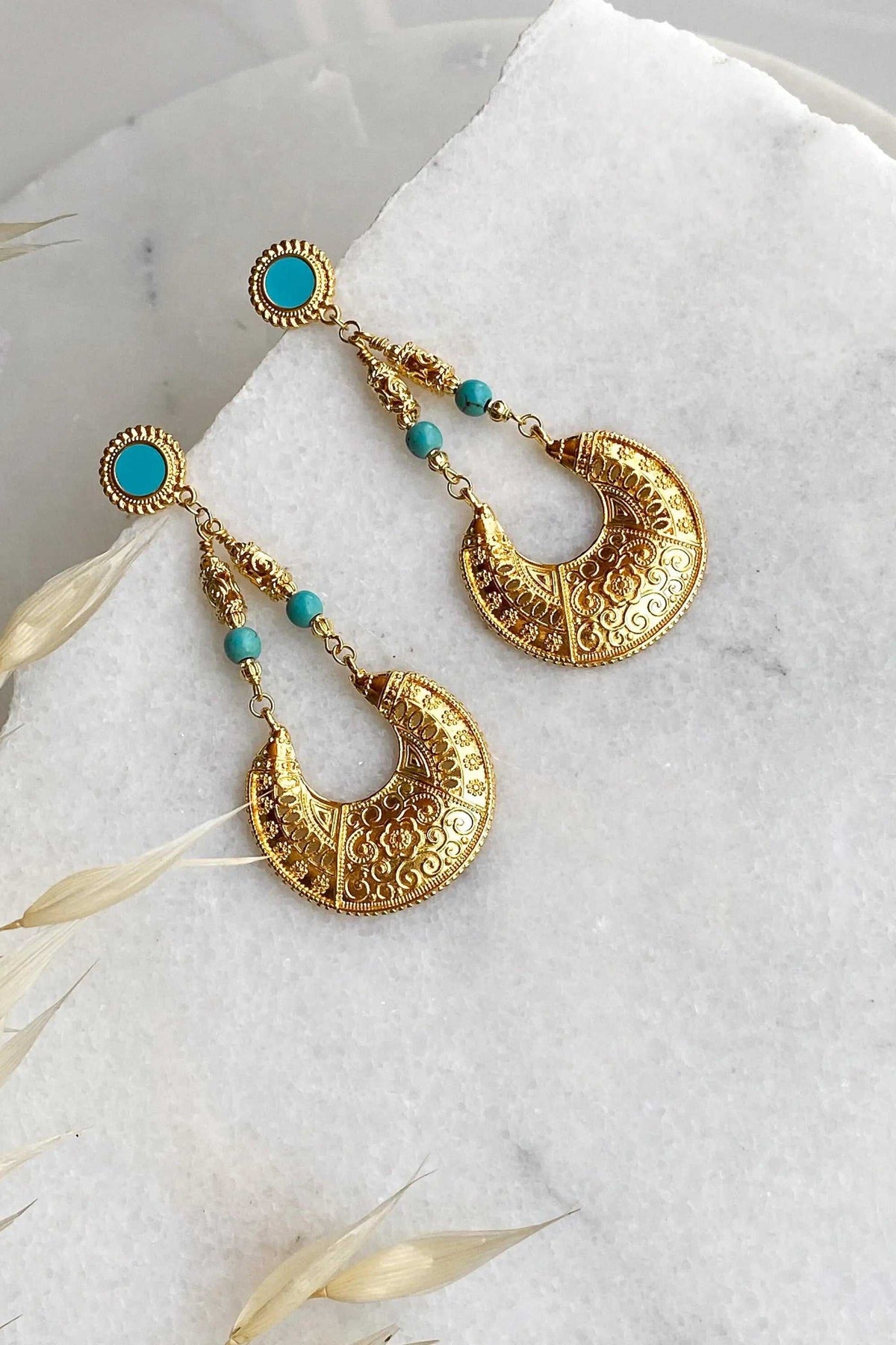 MYRTÓ EARRINGS in ornate gold-tone brass with turquoise beads and round studs, featuring large engraved crescent drops