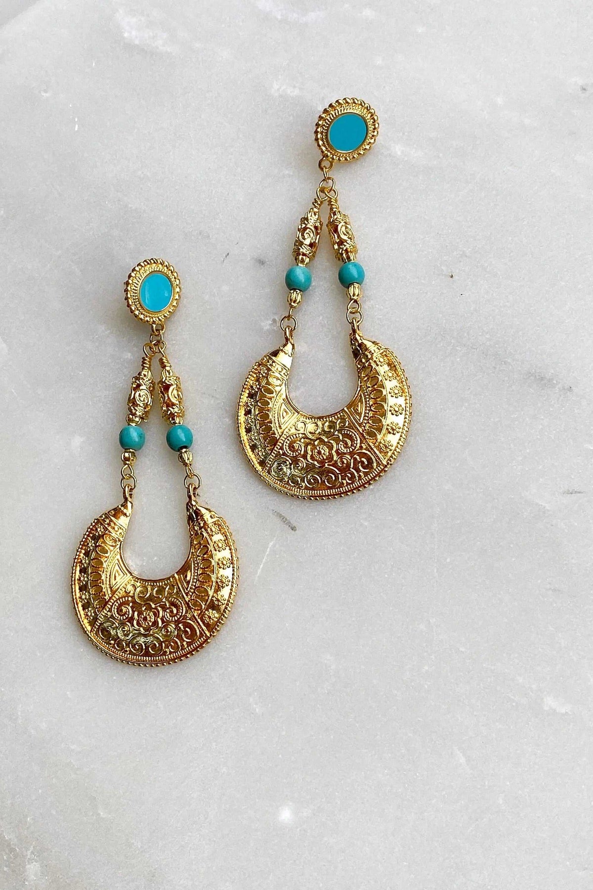 MYRTÓ EARRINGS are oversized gold-tone filigree earrings with turquoise oval studs and bead accents, in a dangling design