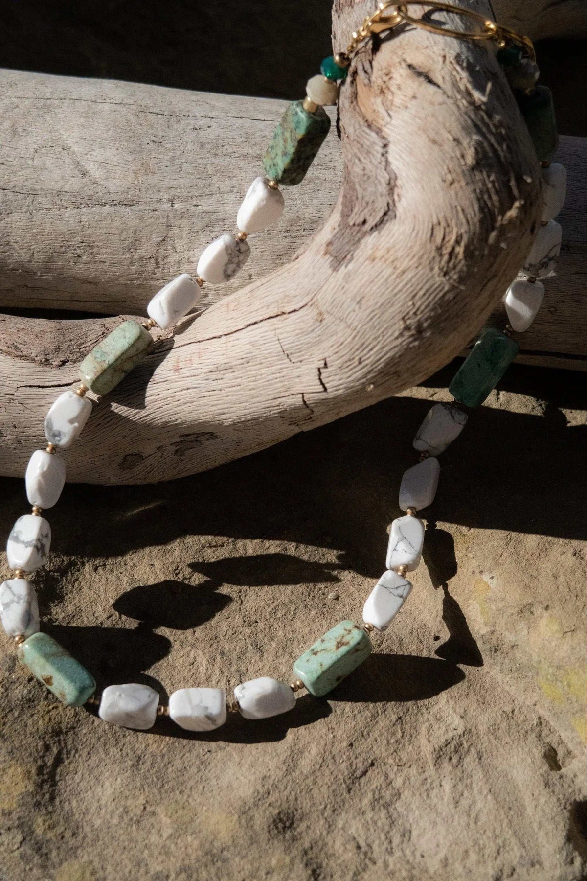 Necklace Crystal Gemstone with irregular white and mint green stones, gold-tone accents and a small heart charm