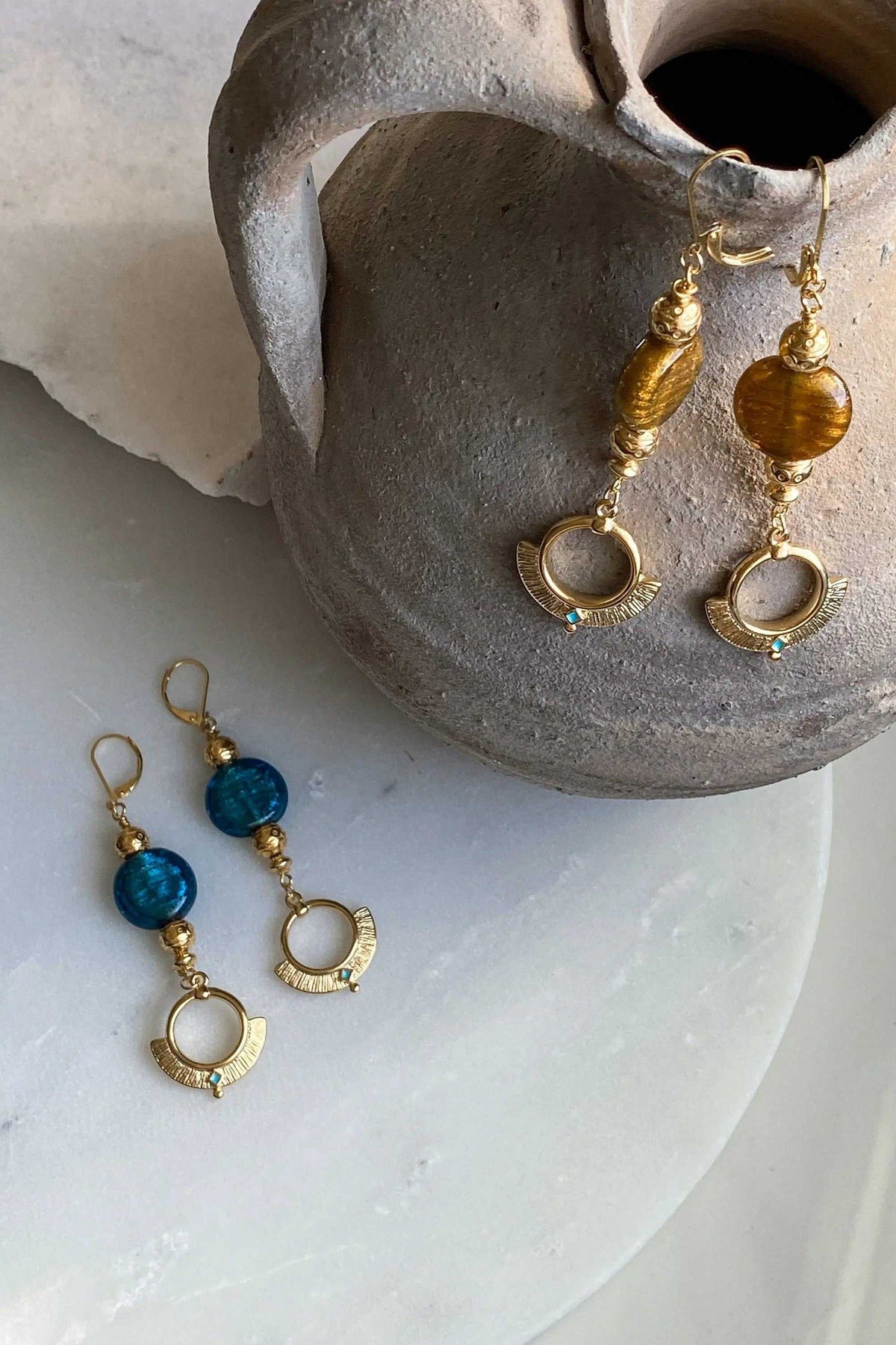 ODYSSOS EARRINGS, gold-tone dangling pairs with textured amber and blue glass beads and open circular charms