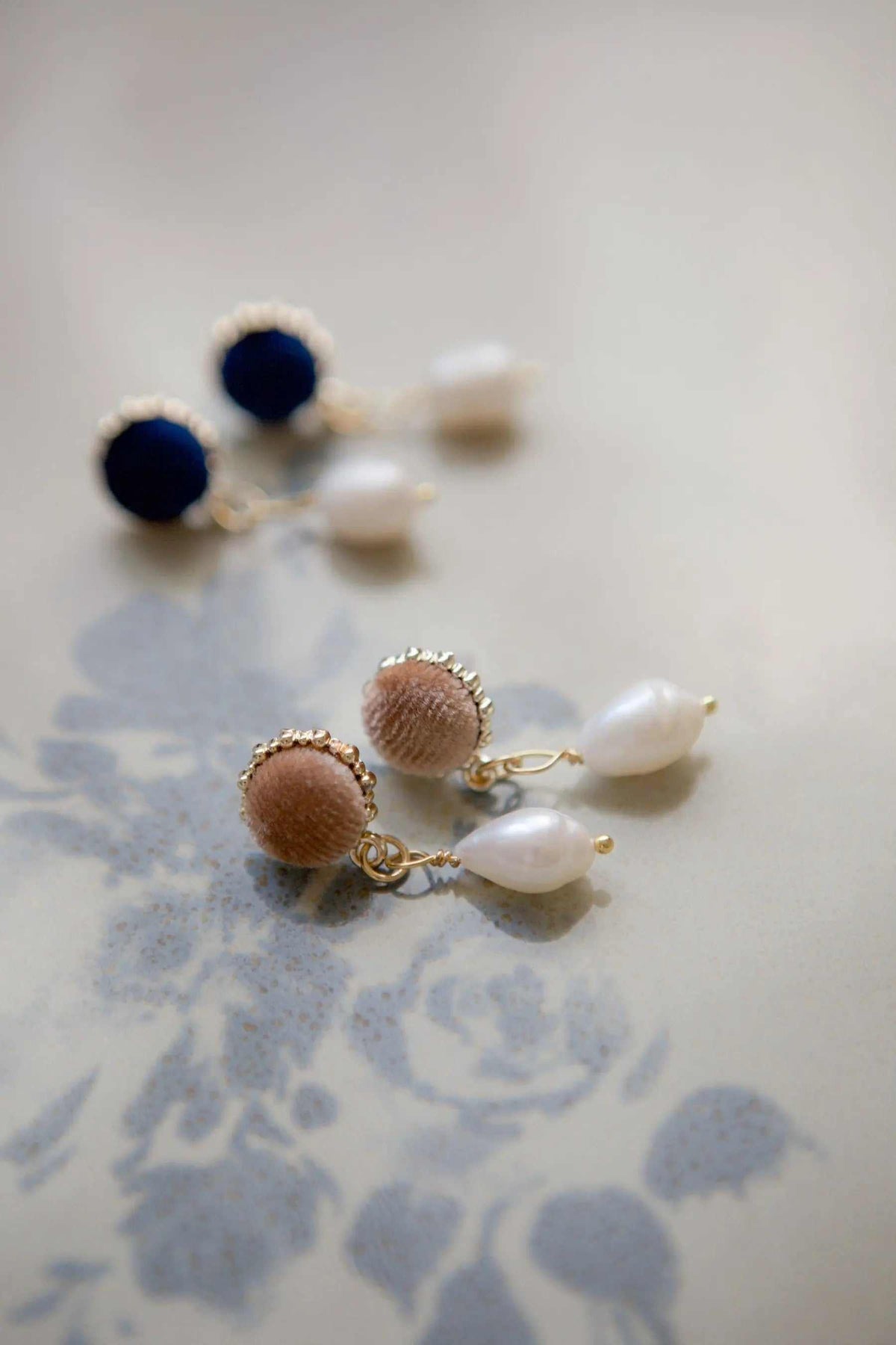 Pearl & velvet Earrings featuring brown velvet spheres, freshwater pearls, and gold-tone metal detailing