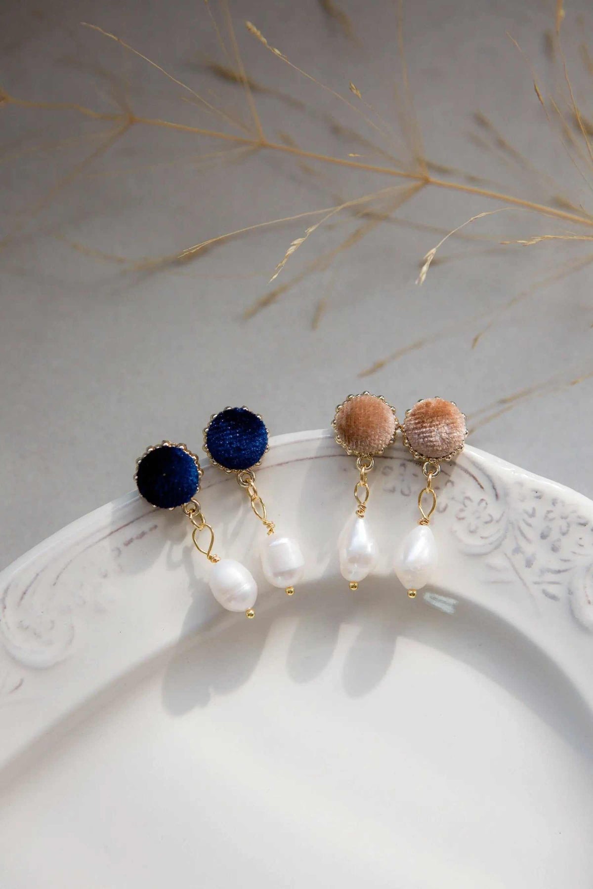Pearl & velvet Earrings with navy and blush velvet studs, gold-tone chains, and dangling freshwater pearls