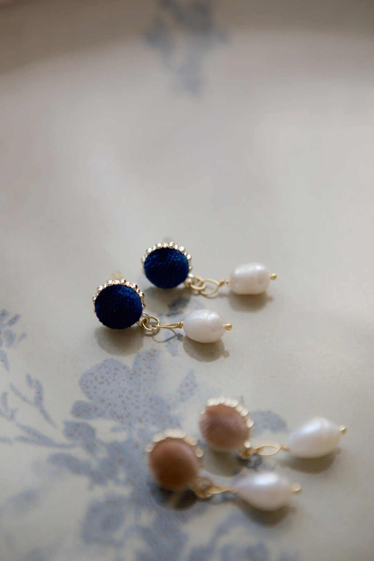 Pearl & velvet Earrings with dark blue and brown velvet studs, freshwater pearl drops, and gold-tone fittings