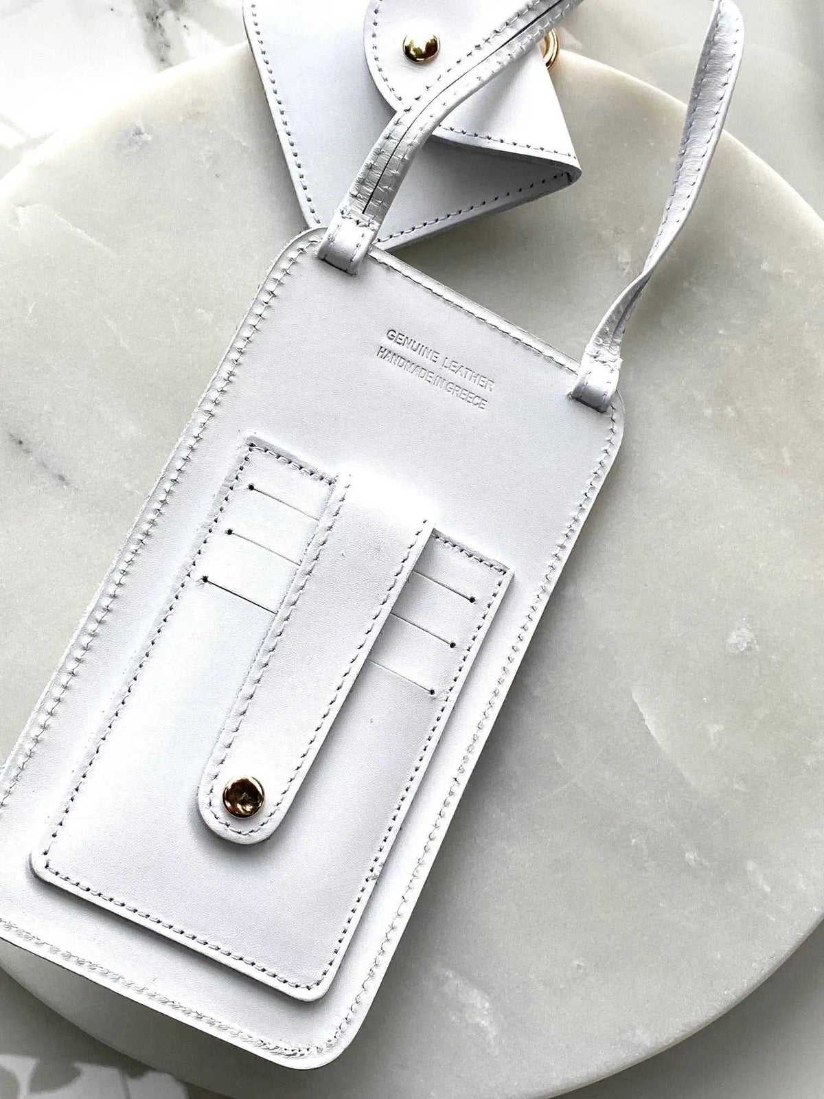 Phone Pouch in white leather with an adjustable shoulder strap, stitched card slots, and a gold-tone snap closure