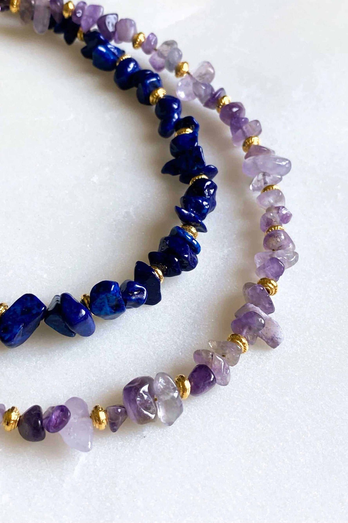 POLYMNIA Blue Jade necklace with deep blue and lavender natural stone chips and gold-toned bead details