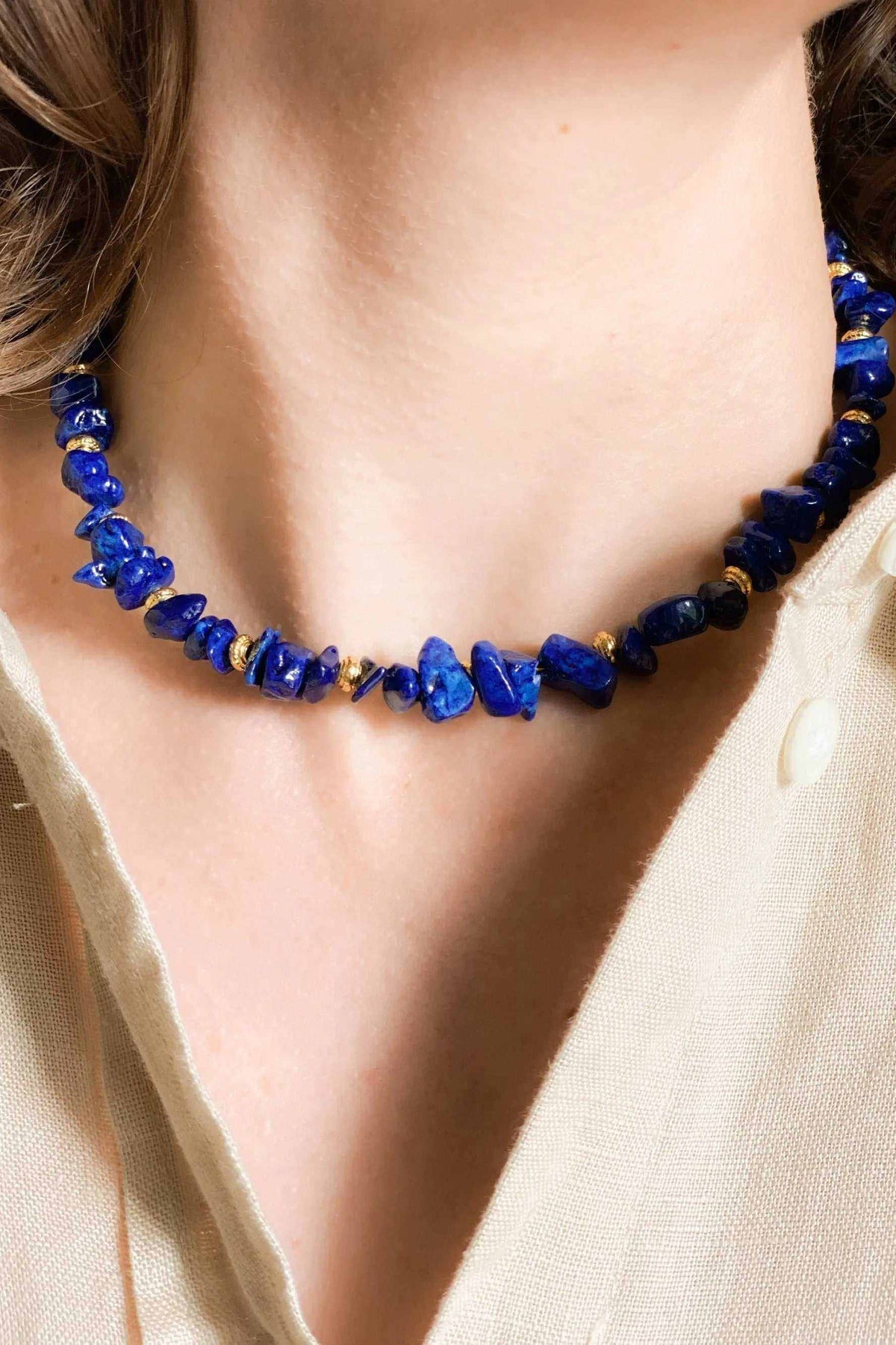POLYMNIA Blue Jade necklace in vivid blue natural stone beads with gold-plated accents and adjustable chain