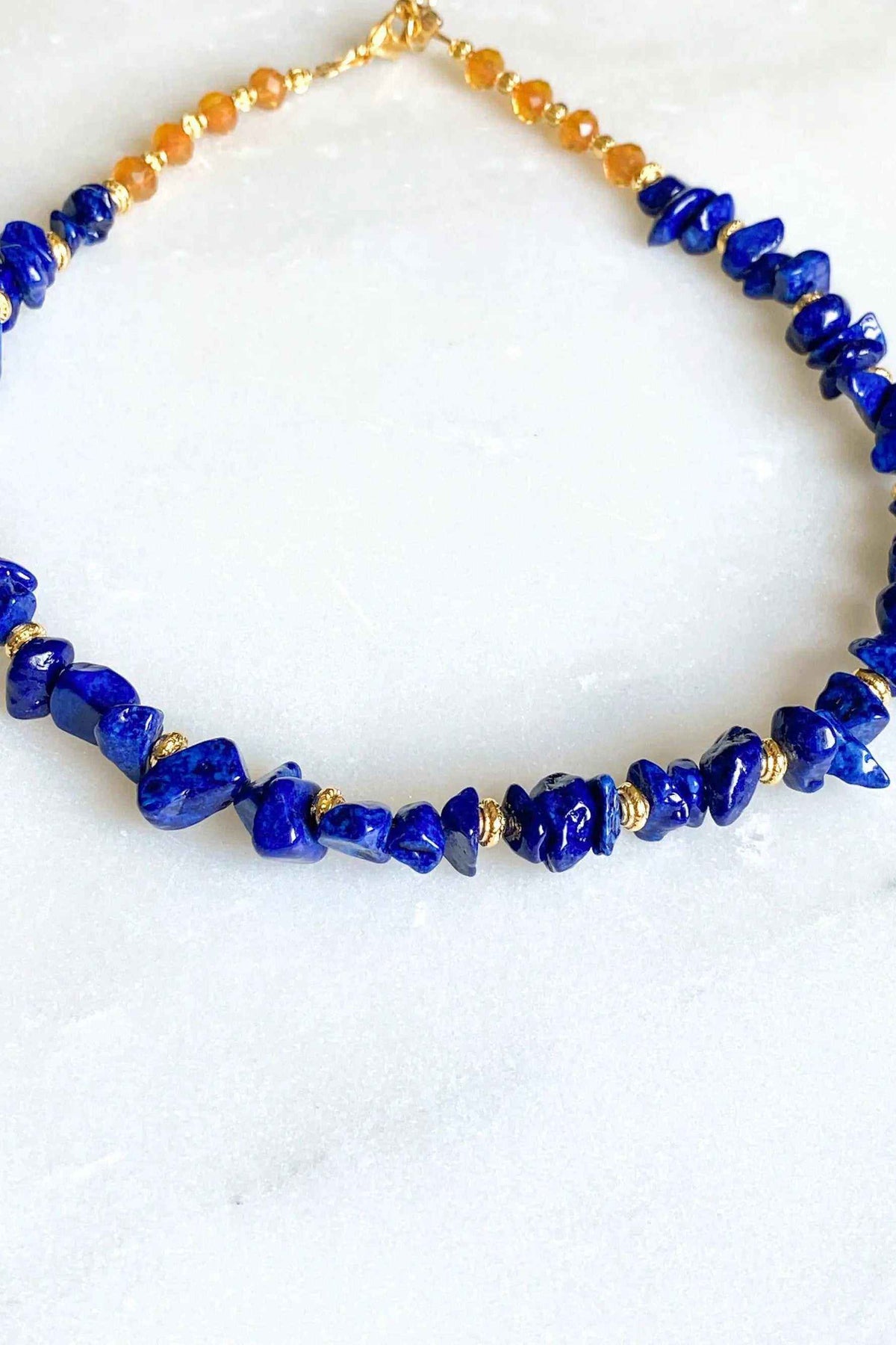 POLYMNIA Blue Jade necklace with vivid blue irregular stone beads and gold-toned spacer details
