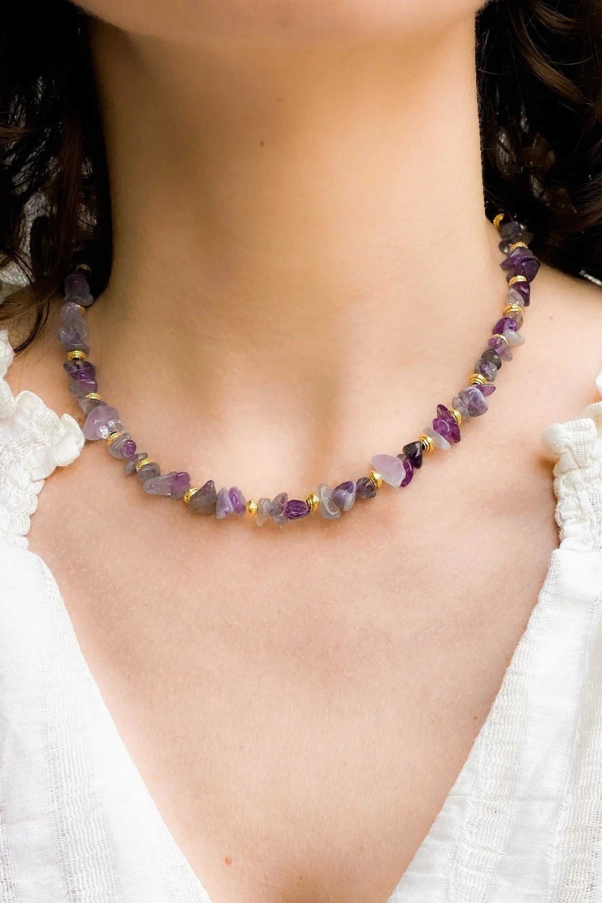 POLYMNIA Blue Jade necklace with purple faceted beads, gold accents, and an adjustable chain