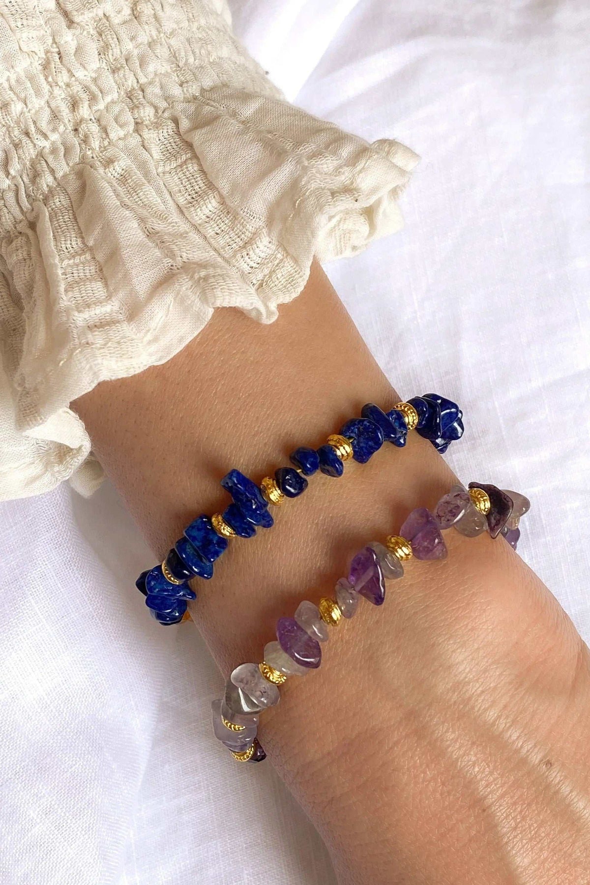 POLYMNIA BRACELET with irregular blue and purple natural stone beads, gold-tone spacers and decorative details