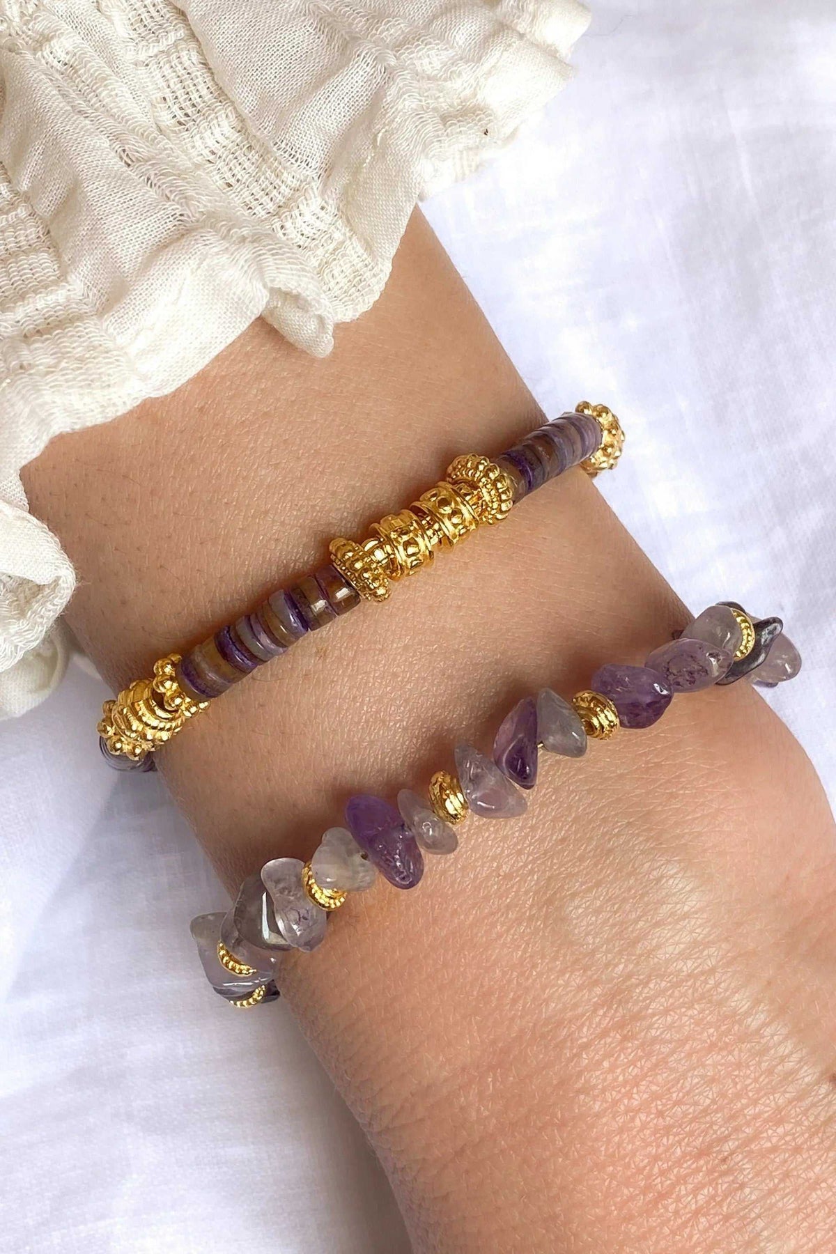 POLYMNIA BRACELET with purple amethyst beads and gold-tone ornate accents, shown as two coordinating strands