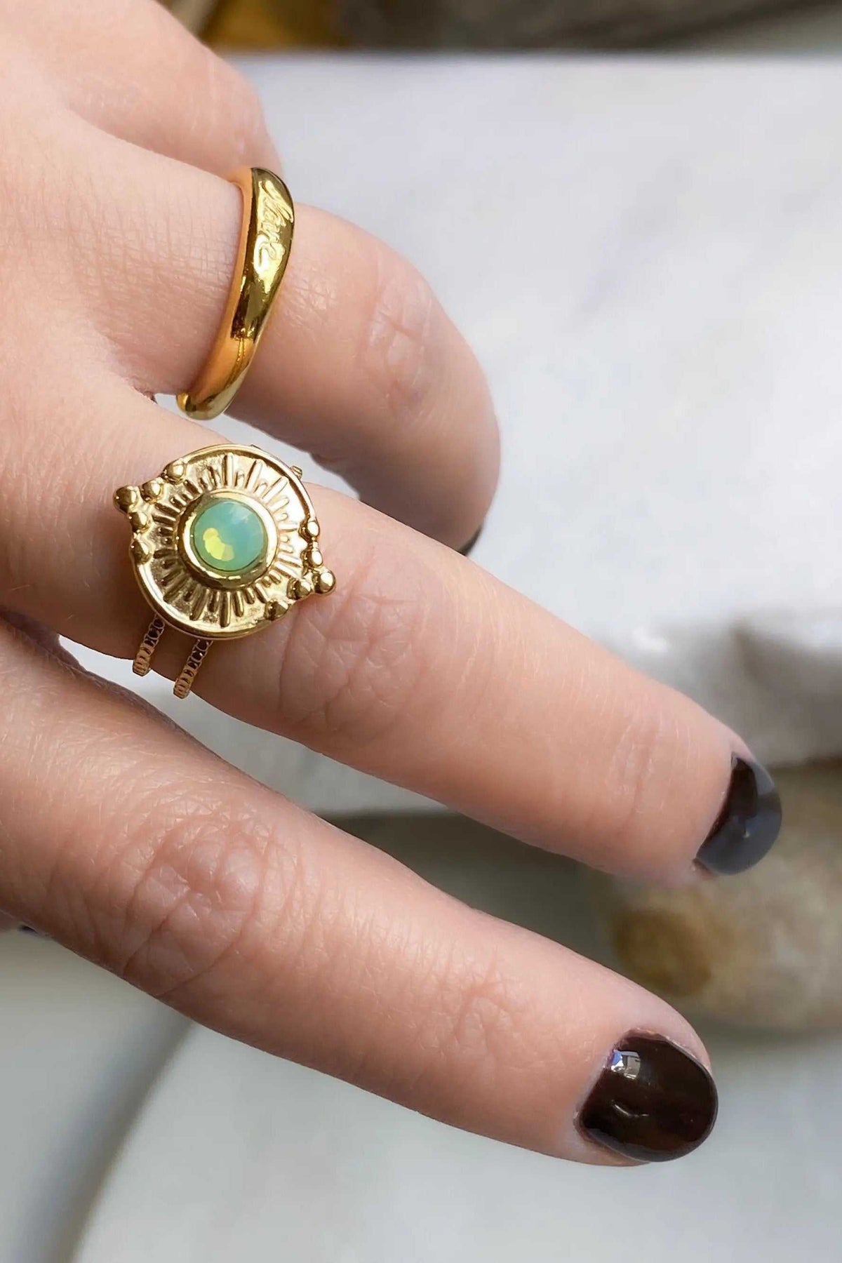 Promise LOVE ring, ornate gold-tone ring with a round turquoise-green center stone and radiating sunburst details
