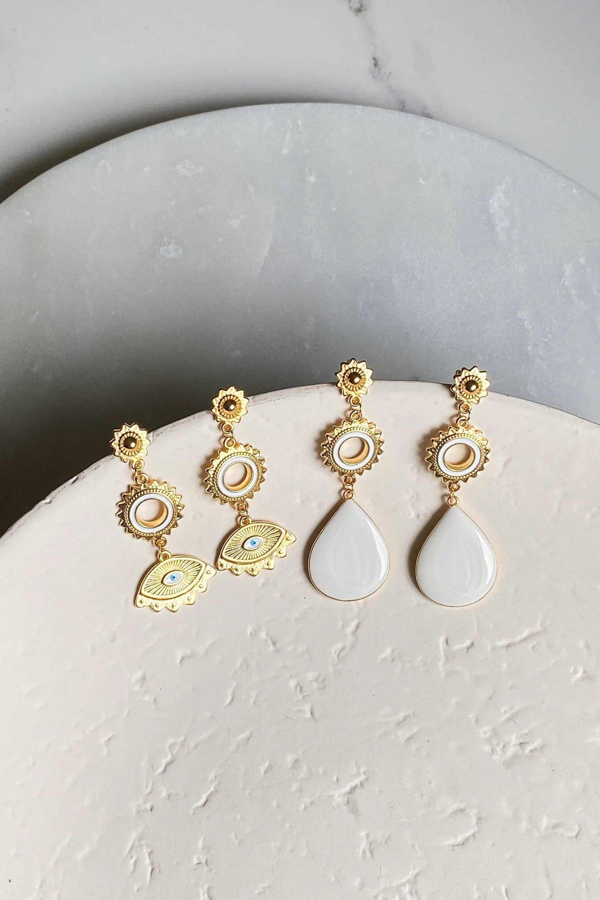 PYTHIA Statement Evil eye earrings, gold-tone dangling pairs with white enamel teardrops and ornate eye motifs