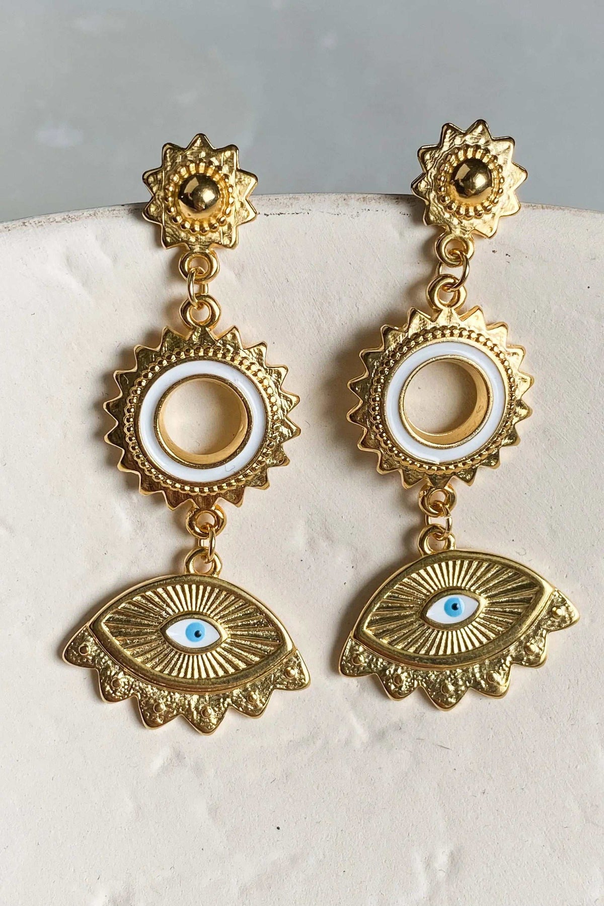 PYTHIA Statement Evil eye earrings in gold-tone metal feature ornate sunbursts, circular drops and blue enamel eye charms