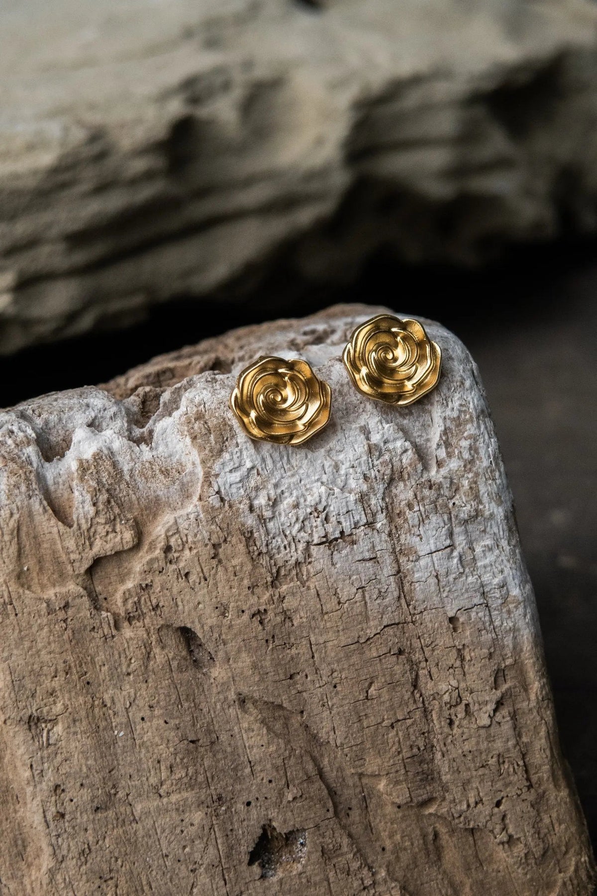 Rose earrings in gold-tone metal, shaped as detailed sculpted roses with layered petals