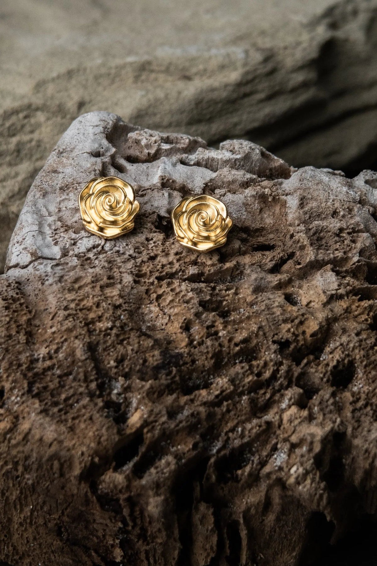Rose earrings in gold-tone metal, shaped as detailed sculpted roses with layered petals