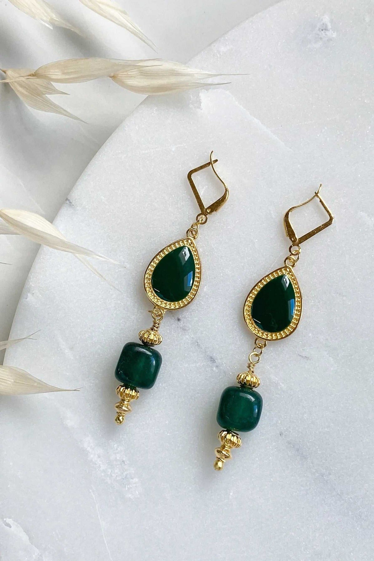 ROXANI Emerald Green earrings with deep green teardrop stones, gold-tone beaded frames, and rounded green bead drops