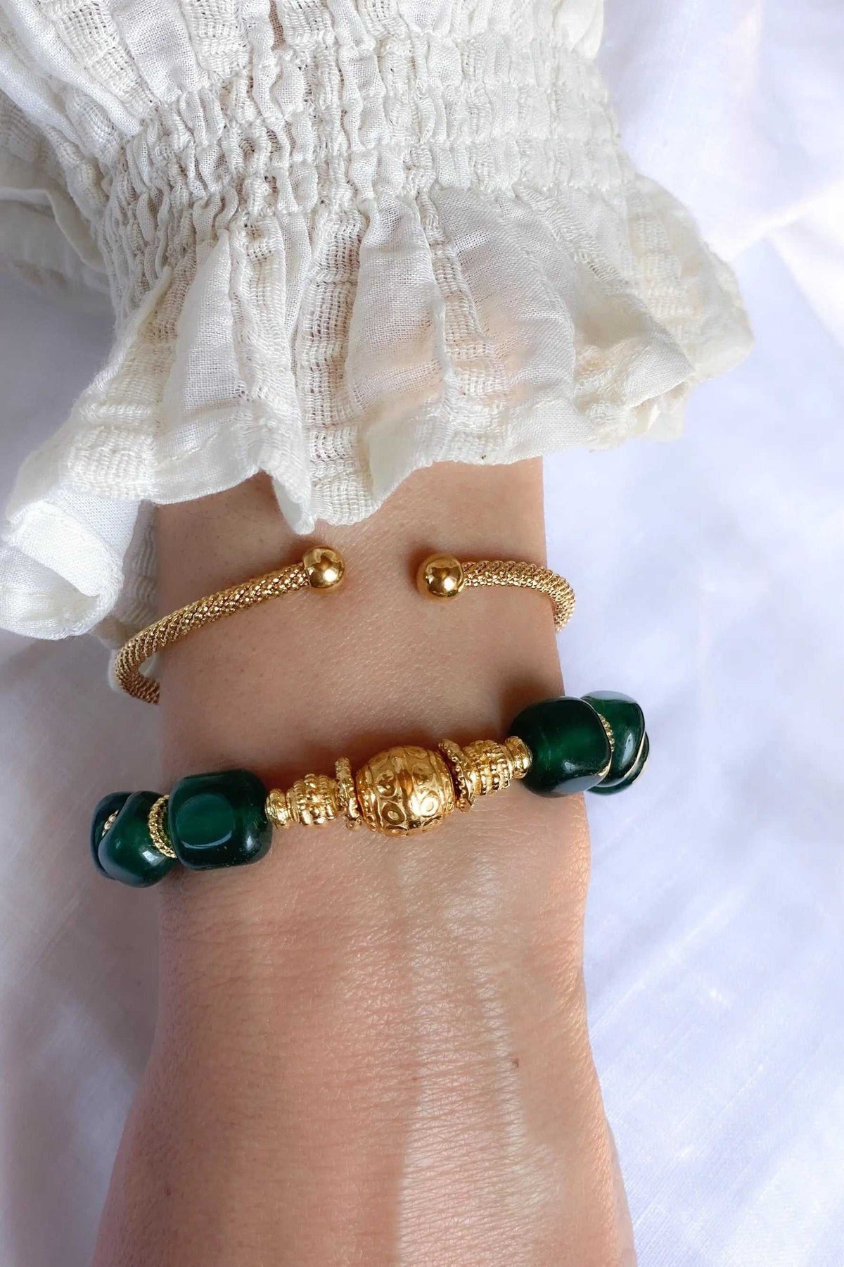ROXANI Emerald Green bracelet with dark green rounded stones, gold-tone beads and ornate central detailing