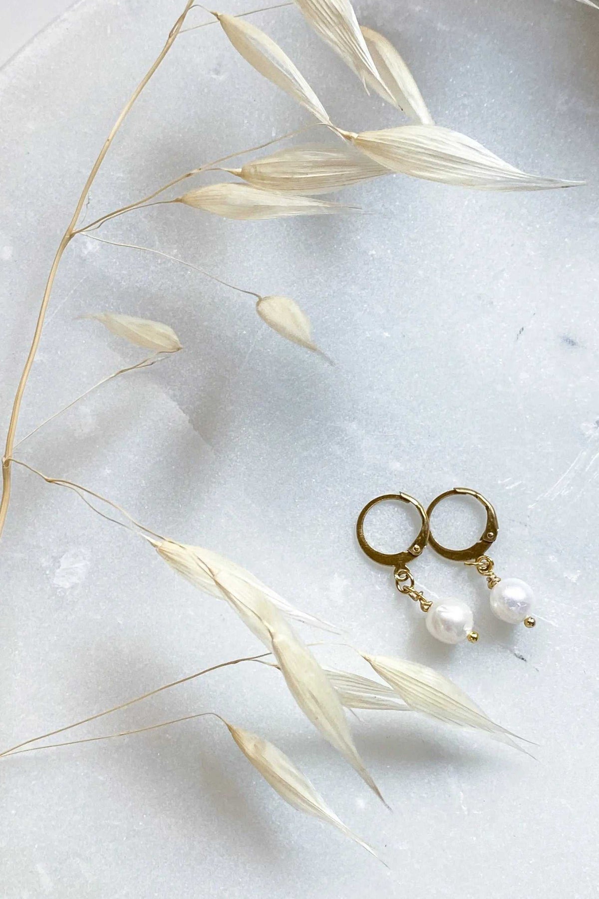 SABINA Gold Huggie Hoop Earrings, small gold hoops with delicate chains and white pearl charms