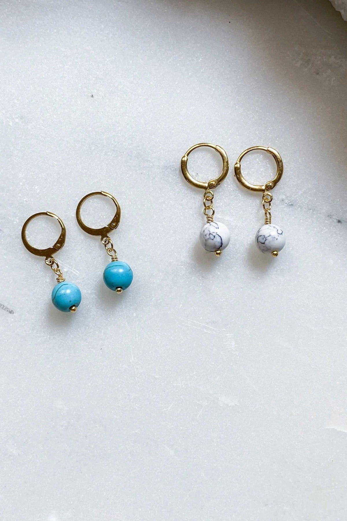 SABINA Gold Huggie Hoop Earrings in gold-tone metal with dangling turquoise and white marbled round beads
