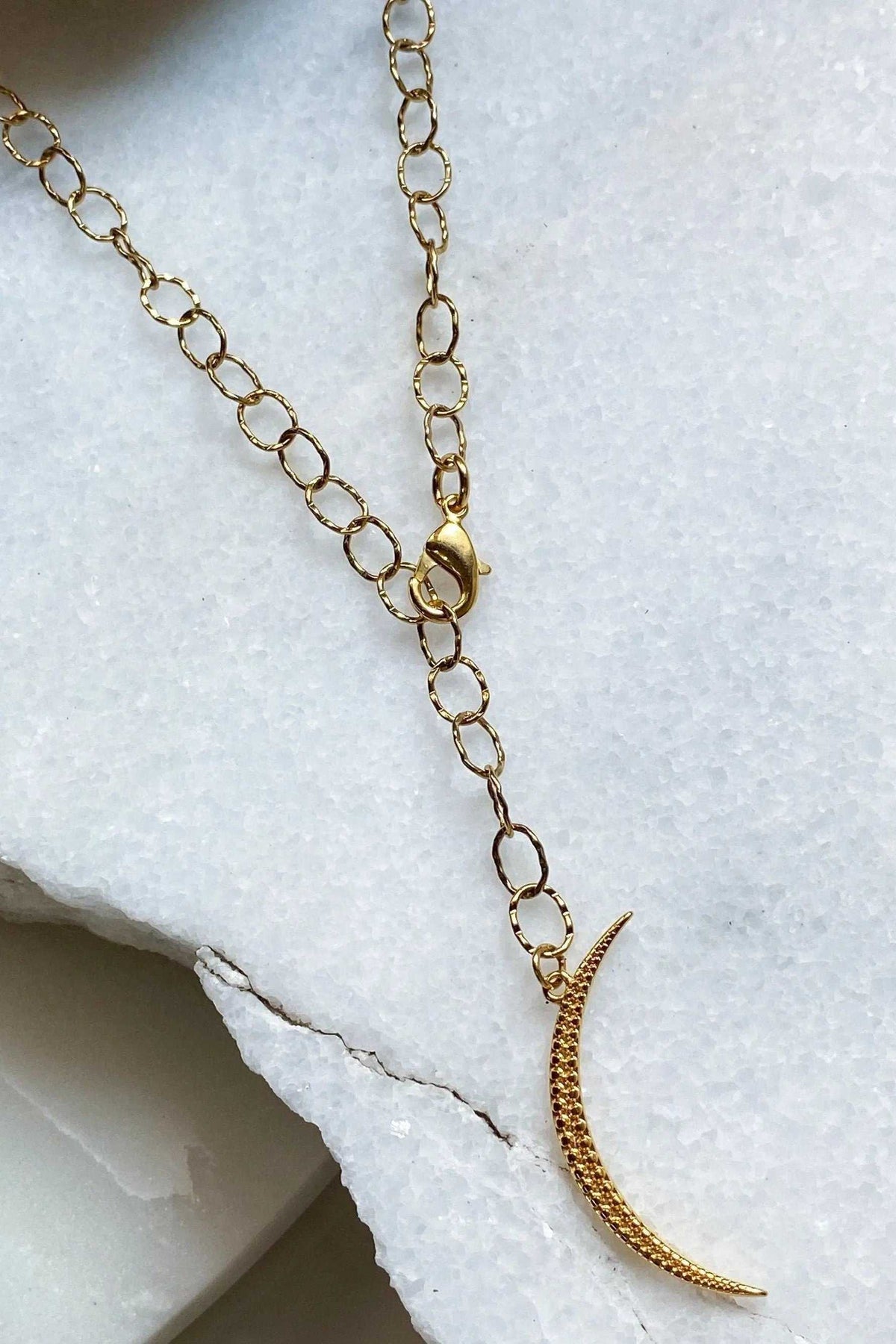 SELENE Moon Lariat Necklace in gold-tone metal with oval chain links, lobster clasp and curved textured pendant