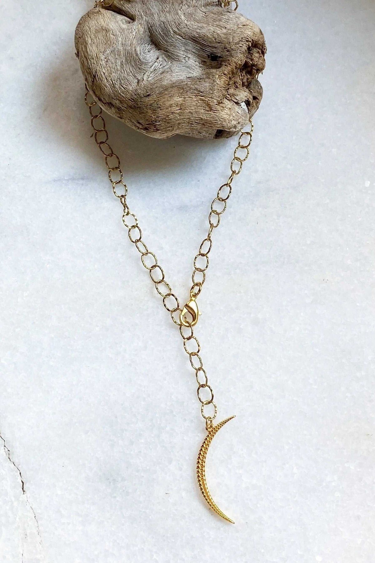 SELENE Moon Lariat Necklace with gold-tone steel chain and slender textured crescent moon pendant