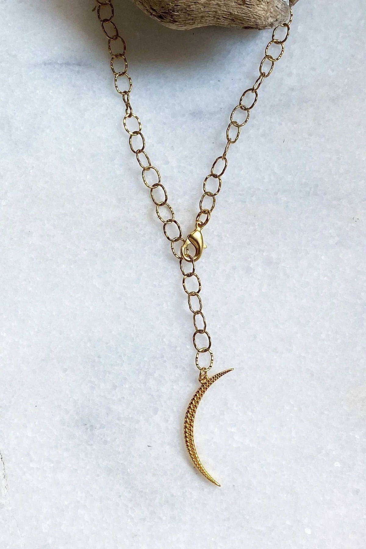 SELENE Moon Lariat Necklace with gold-tone oval-link chain and slim textured crescent moon pendant