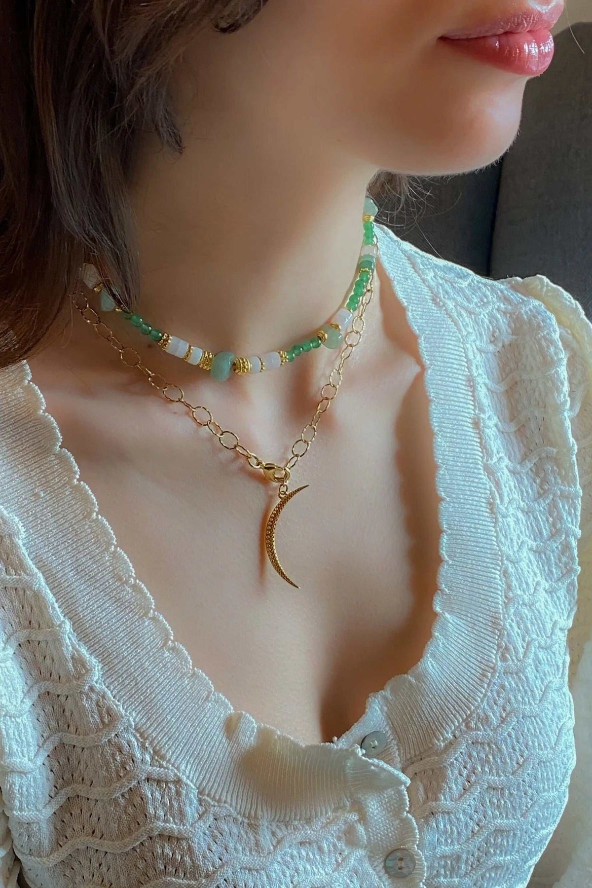SELENE Moon Lariat Necklace with gold-tone chain and thin crescent moon pendant, layered with a beaded necklace