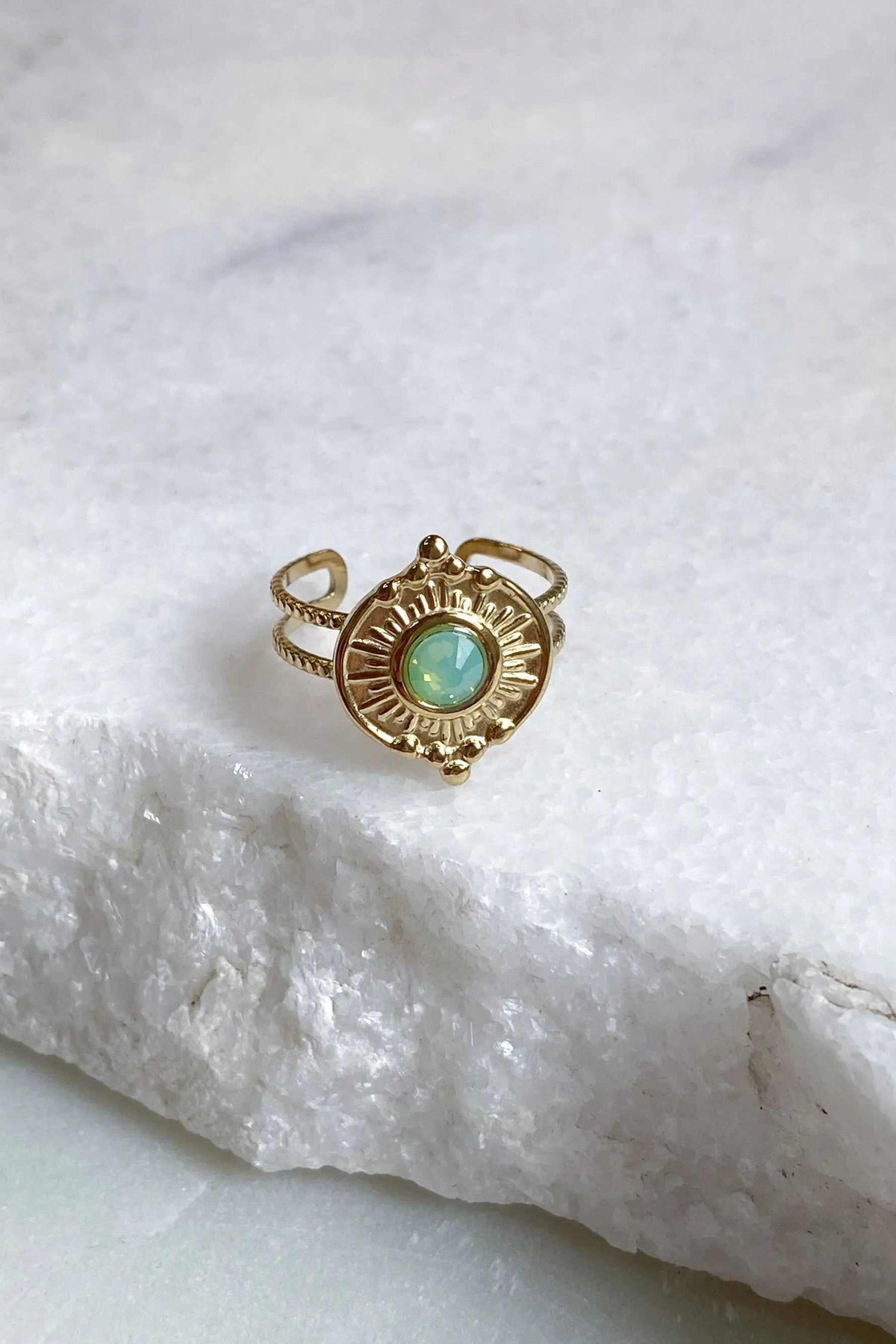 SEZAN Gold Stone Ring in gold-tone metal with a round turquoise-green stone, sunburst detailing and open adjustable band