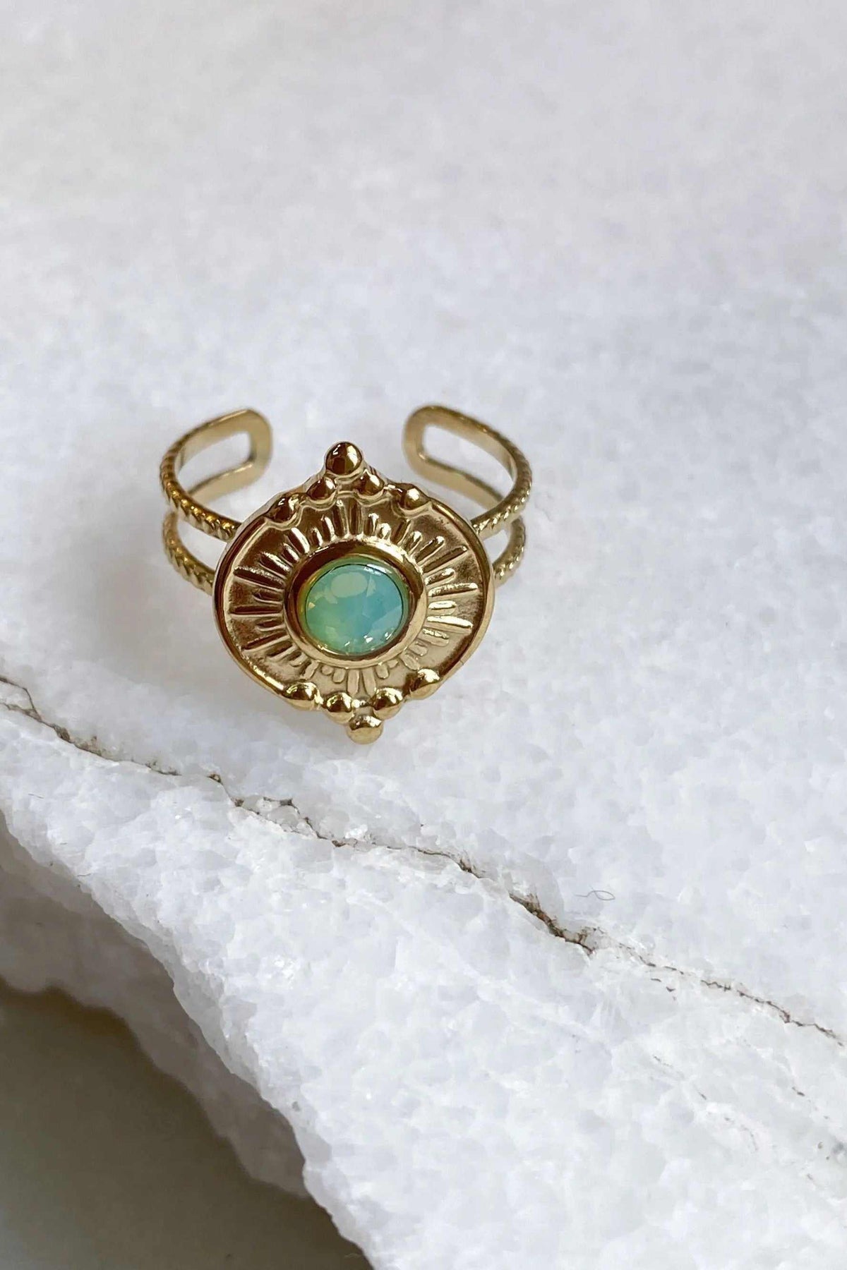 SEZAN Gold Stone Ring in gold-tone metal with an ornate sunburst setting and round turquoise-green stone
