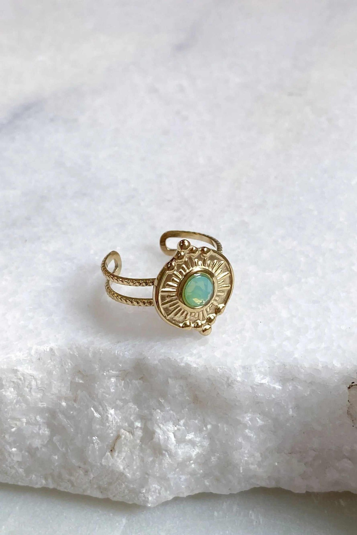 SEZAN Gold Stone Ring in gold-tone metal with a round turquoise-green stone and a radiating sunburst bezel