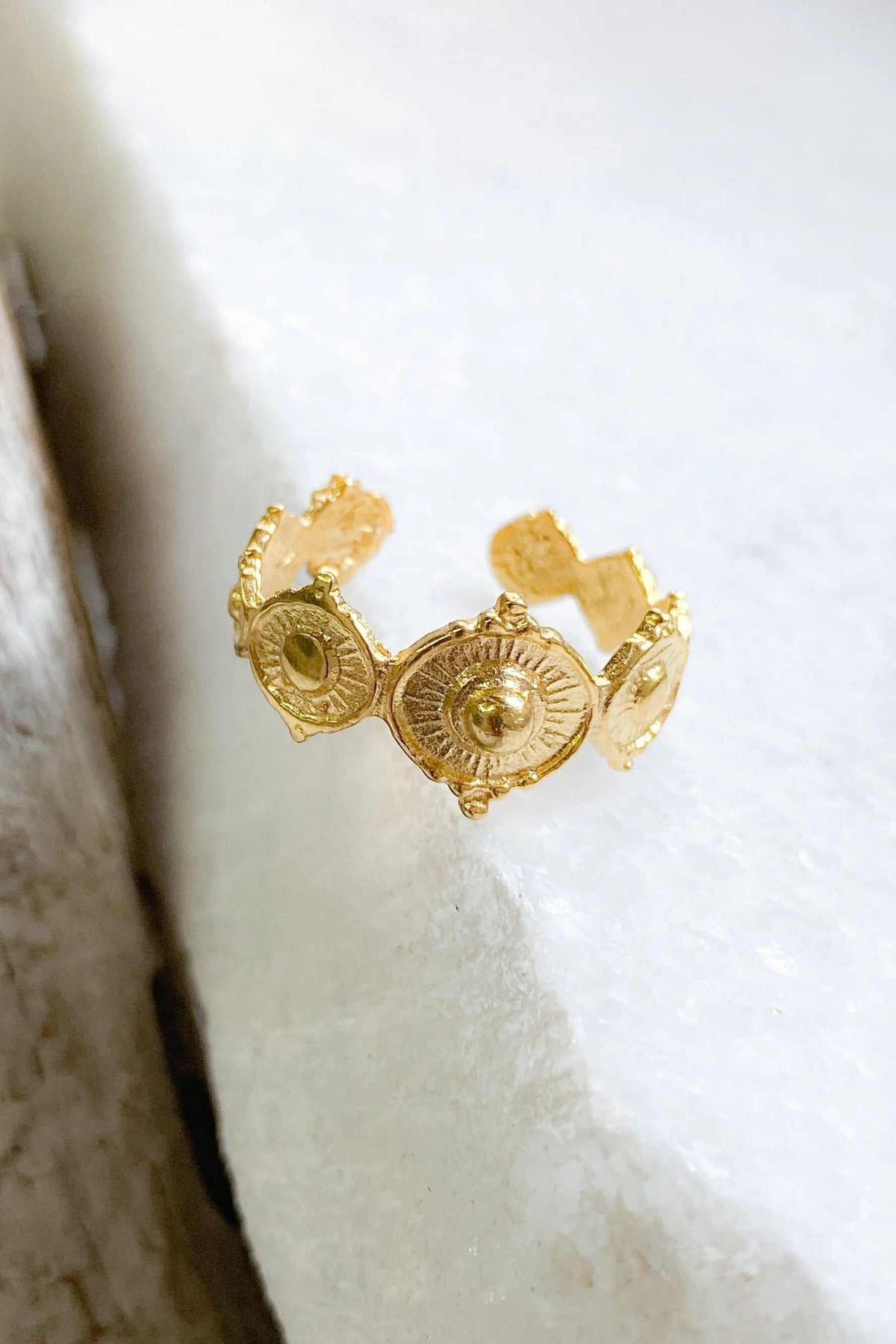 SHARMA Dotted gold ring in bright gold-tone metal, featuring three ornate round medallions with raised dotted detailing