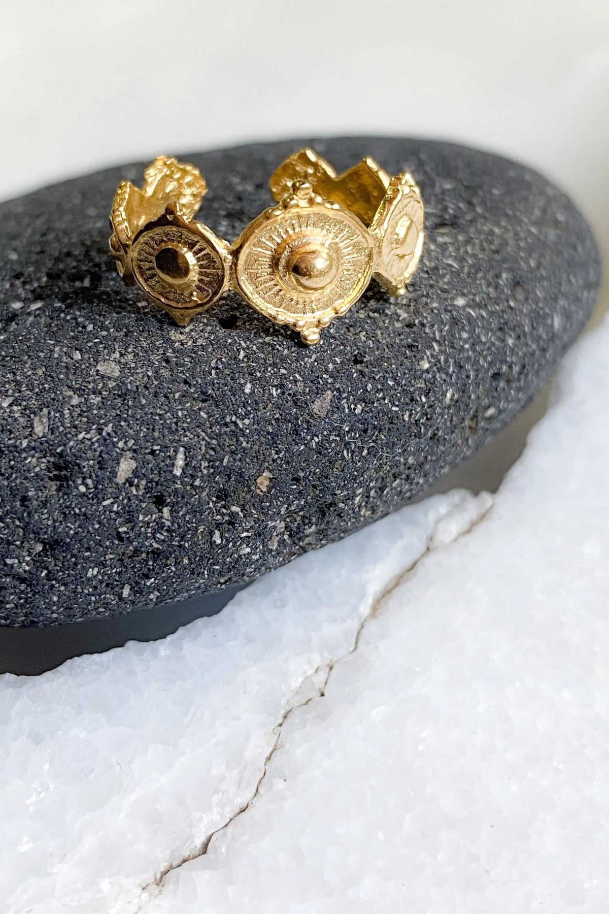 SHARMA Dotted gold ring in textured gold-tone metal, with raised circular medallions and an open adjustable band