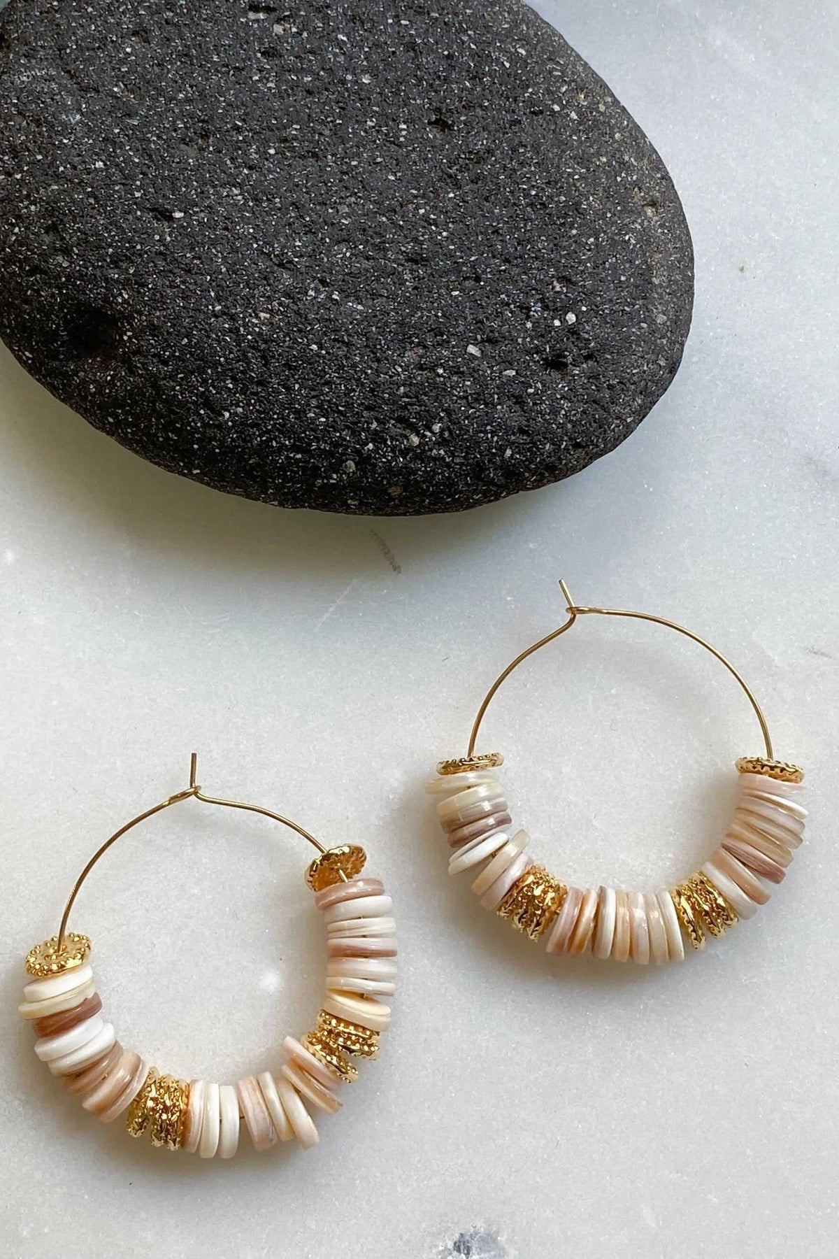 SHELL Hoop earrings with white shell heishi beads, gold-tone hoops, and decorative gold spacers