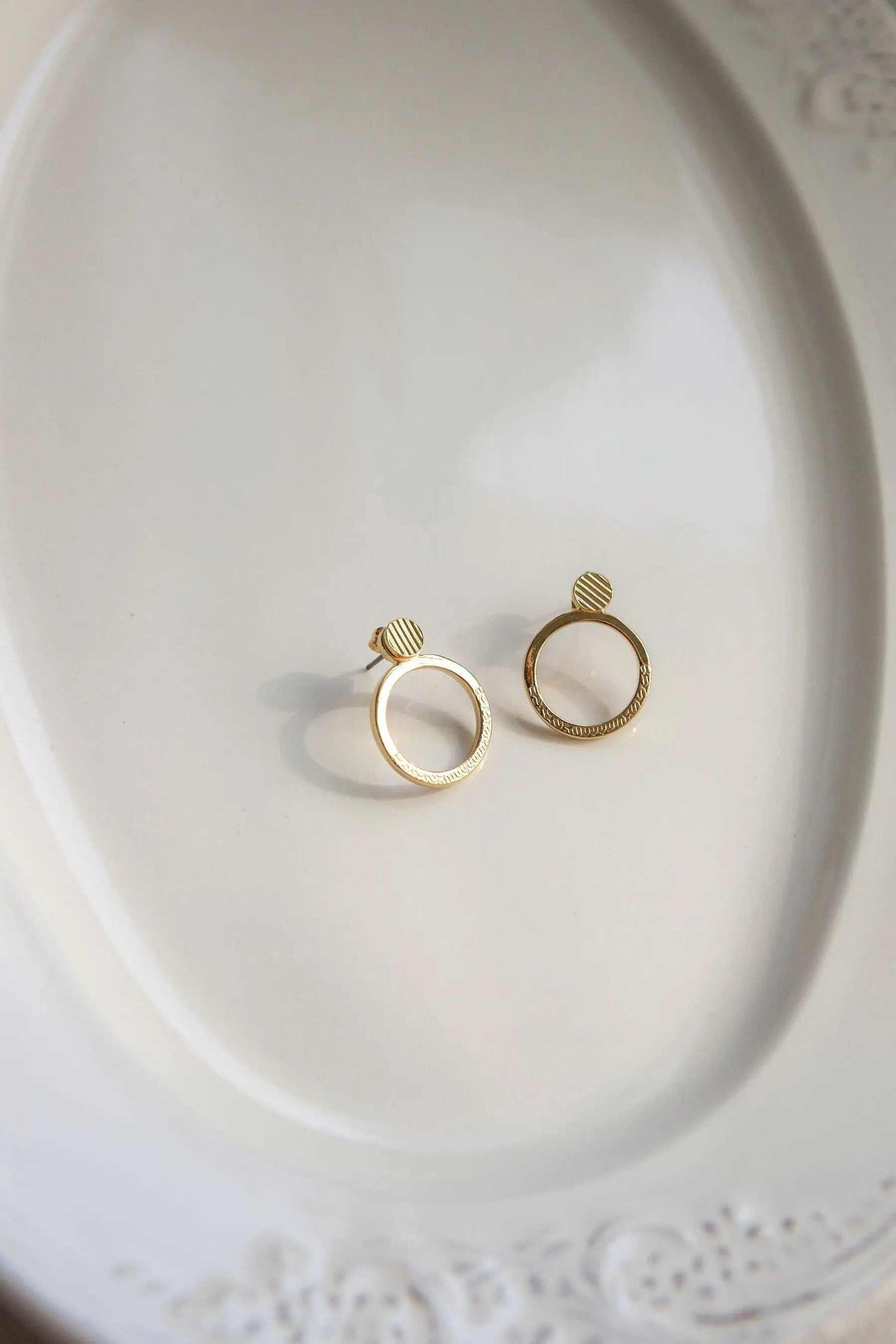 Small Stripe patterned Hoops in gold-tone metal with striped circular studs and polished hoop earrings
