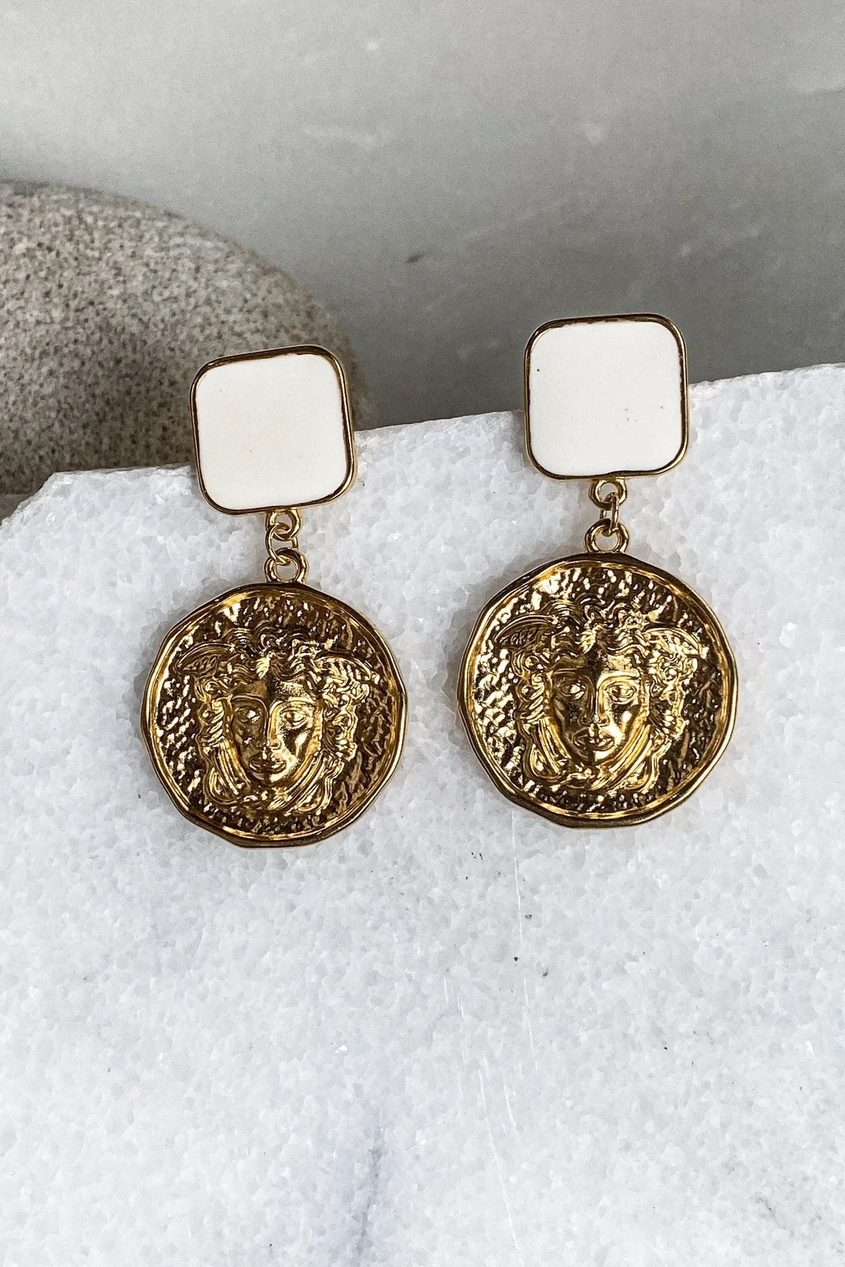 SNAKE Gold Coin Earrings with ornate embossed gold-tone coin charms and square ivory stud tops