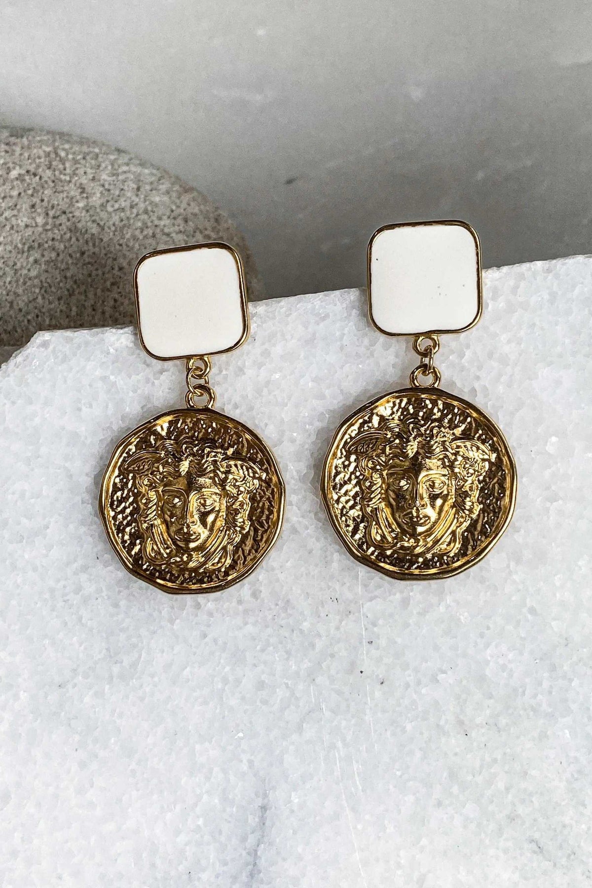 SNAKE Gold Coin Earrings with square ivory studs and ornate round gold-tone coin pendants featuring raised faces