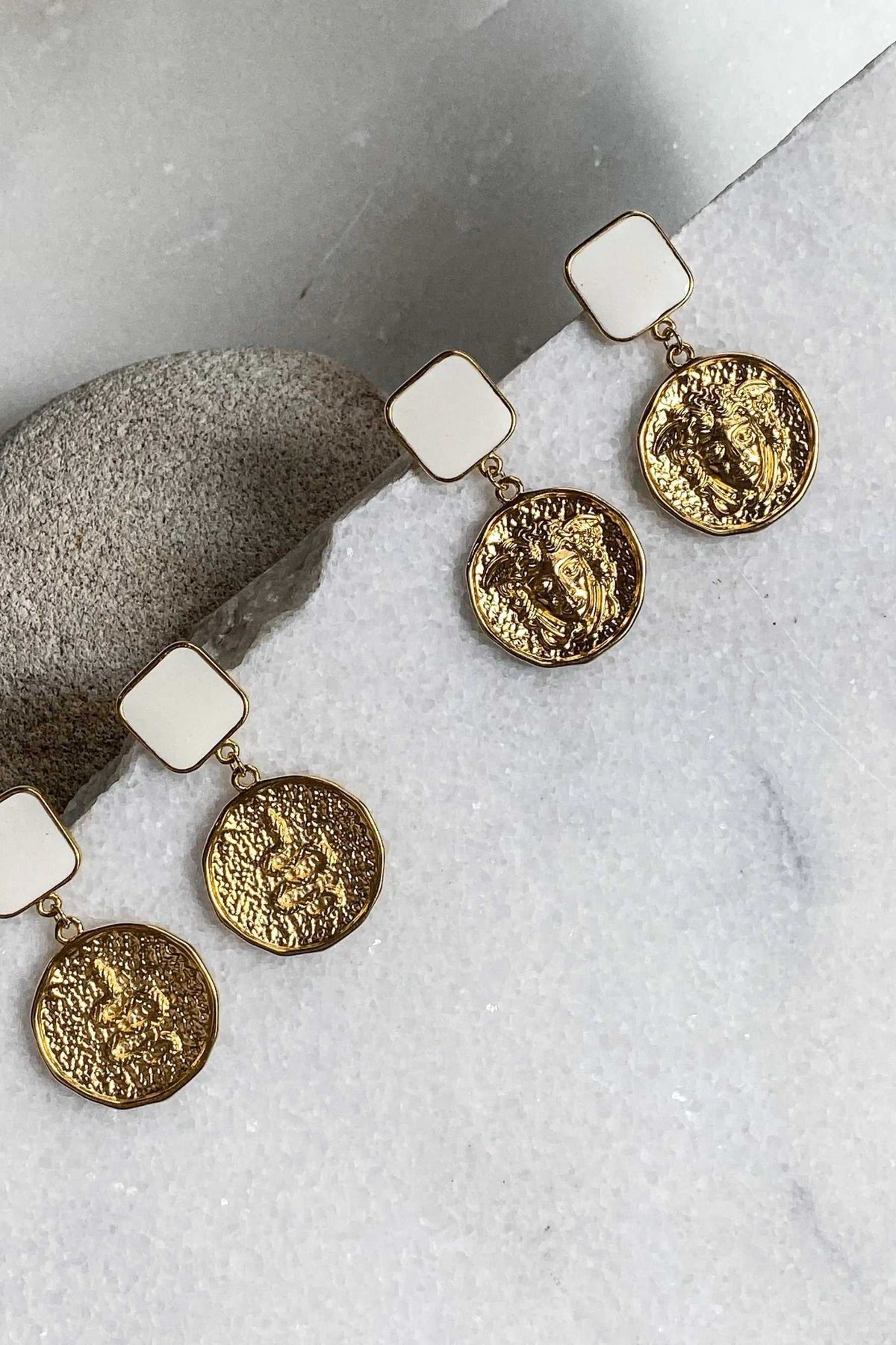SNAKE Gold Coin Earrings with textured gold-tone coin charms and square ivory-colored studs in a dangling design