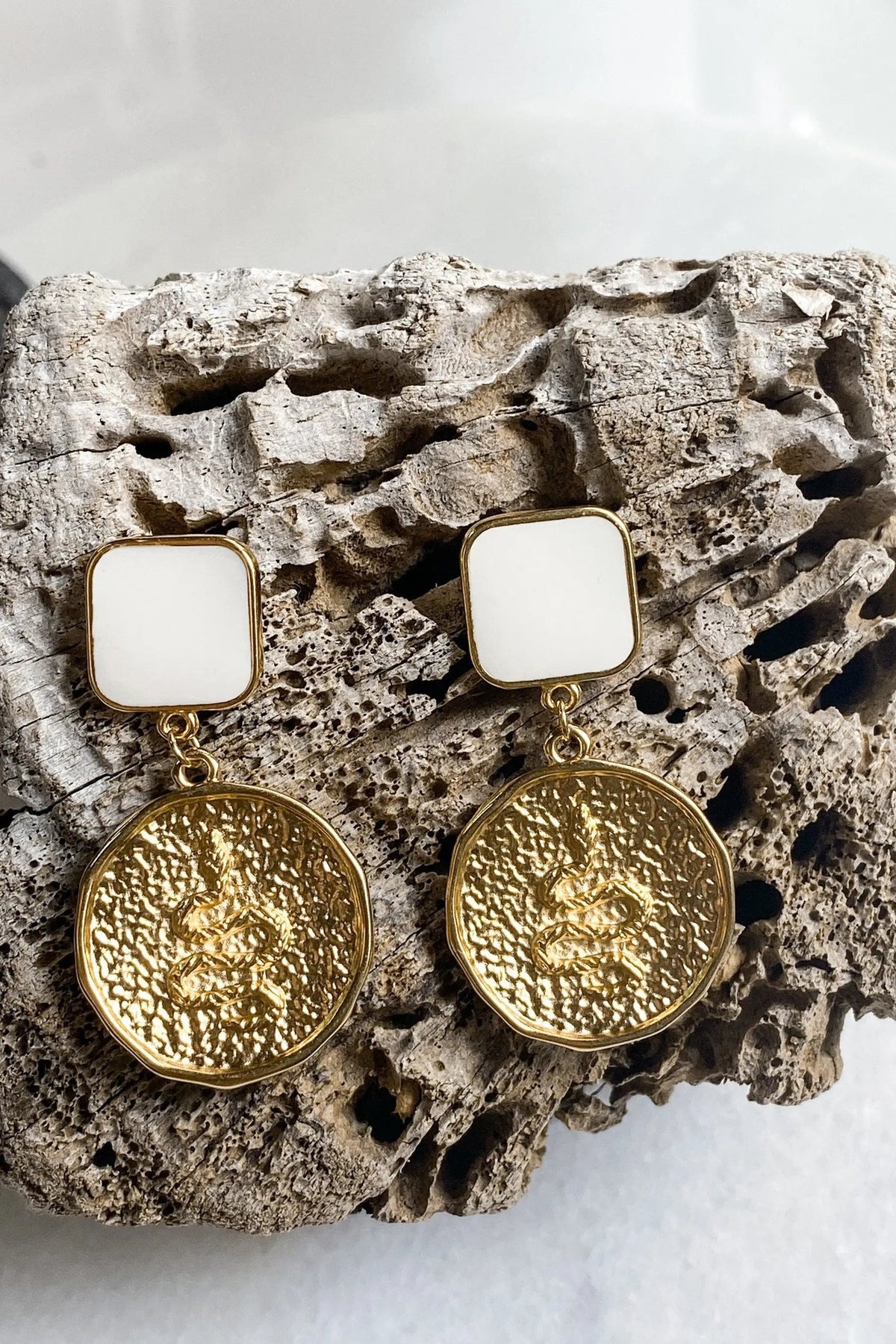 SNAKE Gold Coin Earrings with gold-tone textured round medallions, white square tops and dangling drop design