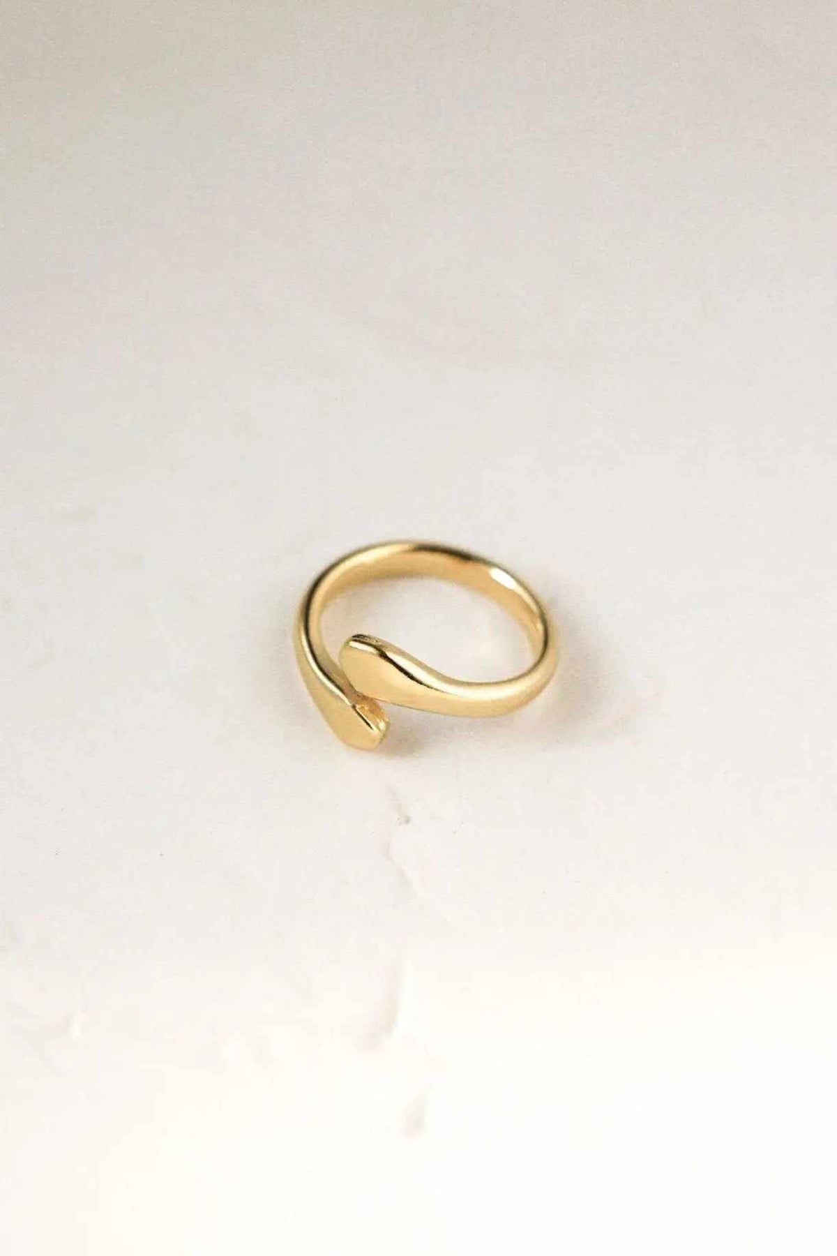 Snake Wrap RING in polished gold-tone metal, formed as a smooth adjustable serpent with a curled, open-ended shape