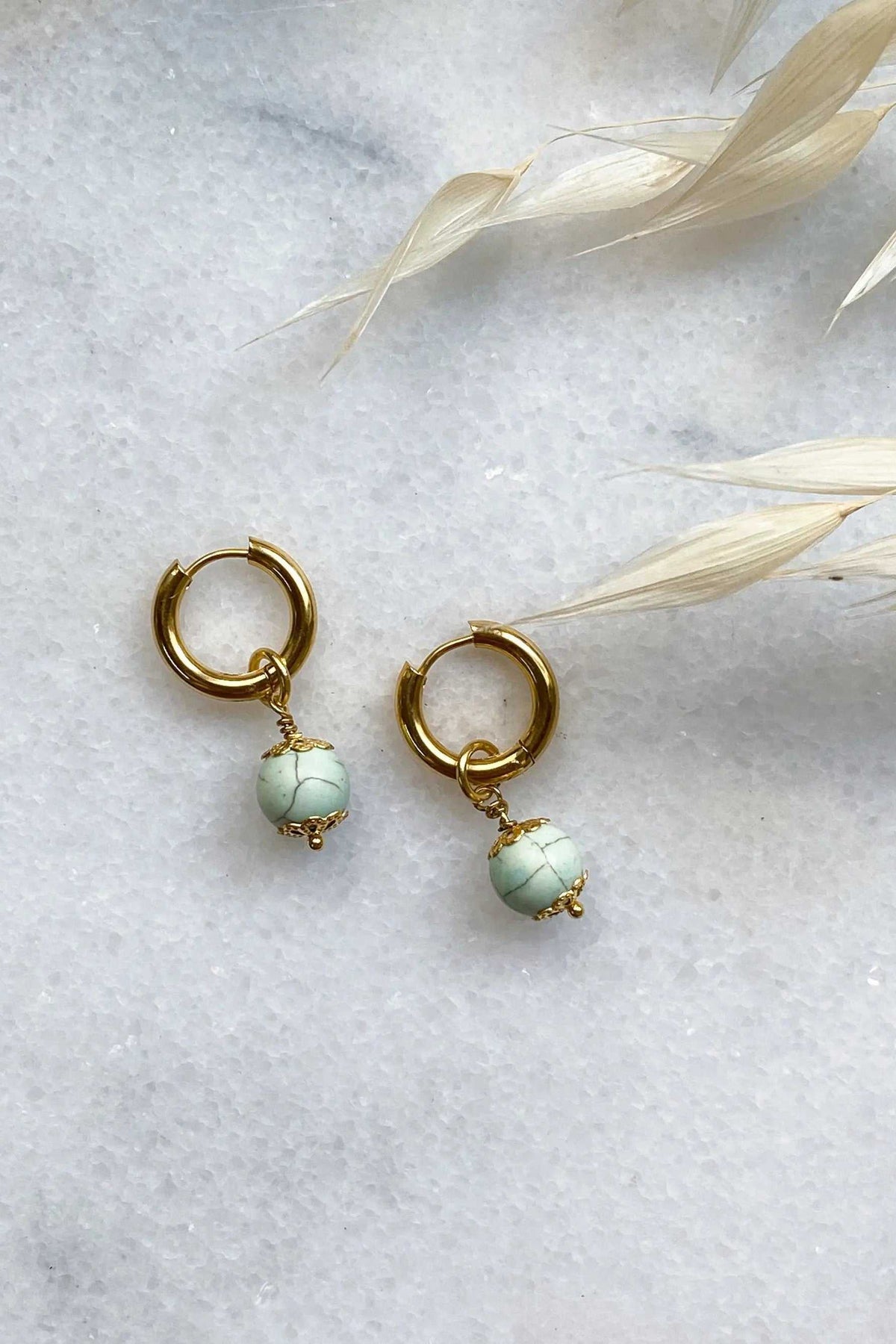 SORAYA medium earrings, gold huggie hoops with pale green textured gem charms and small gold bead details
