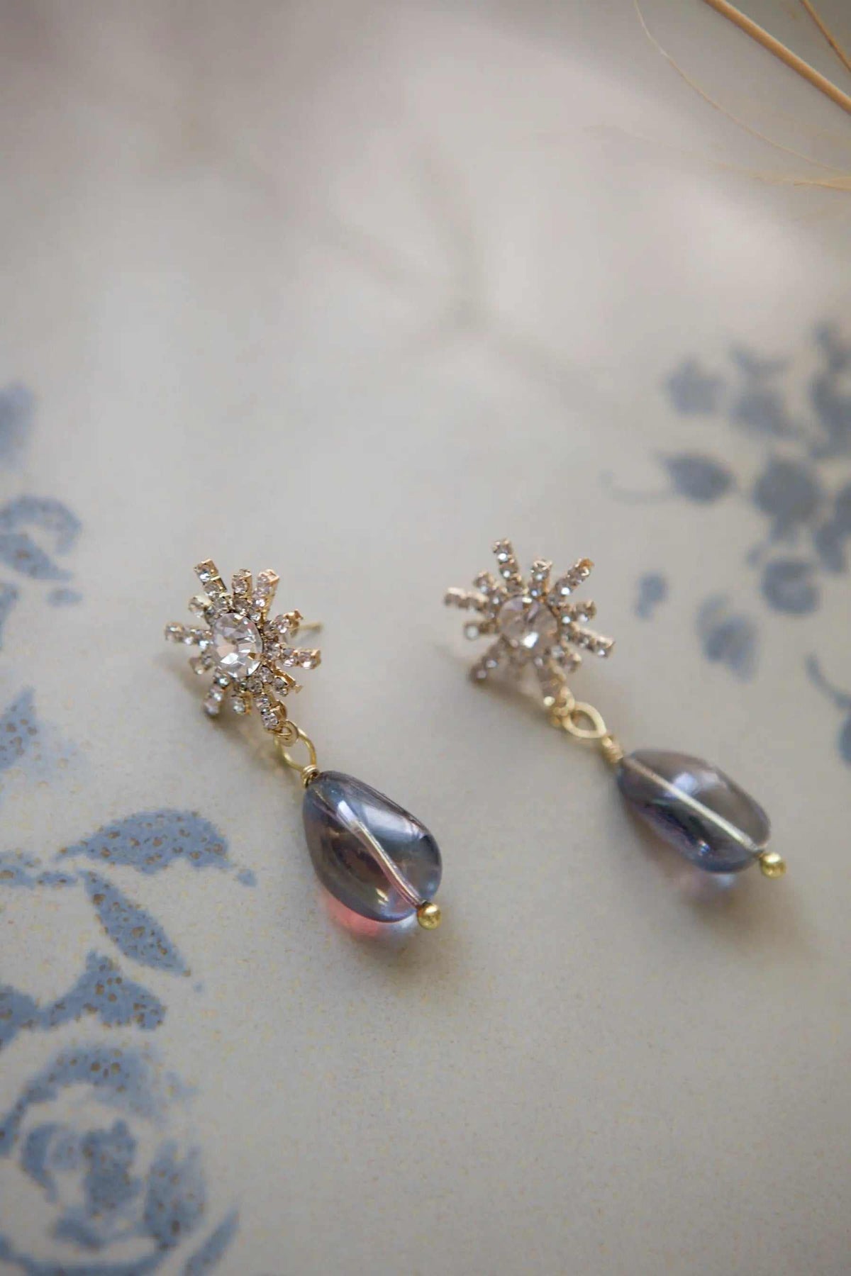 Star strass earrings with silver crystal star clusters and iridescent purple teardrop beads